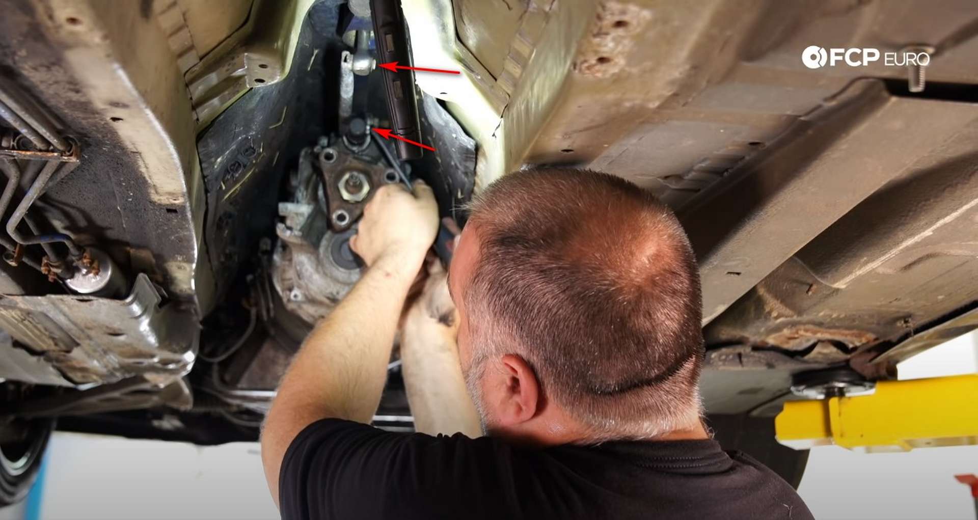 DIY BMW E46 Clutch Replacement removing the driveshaft bolts