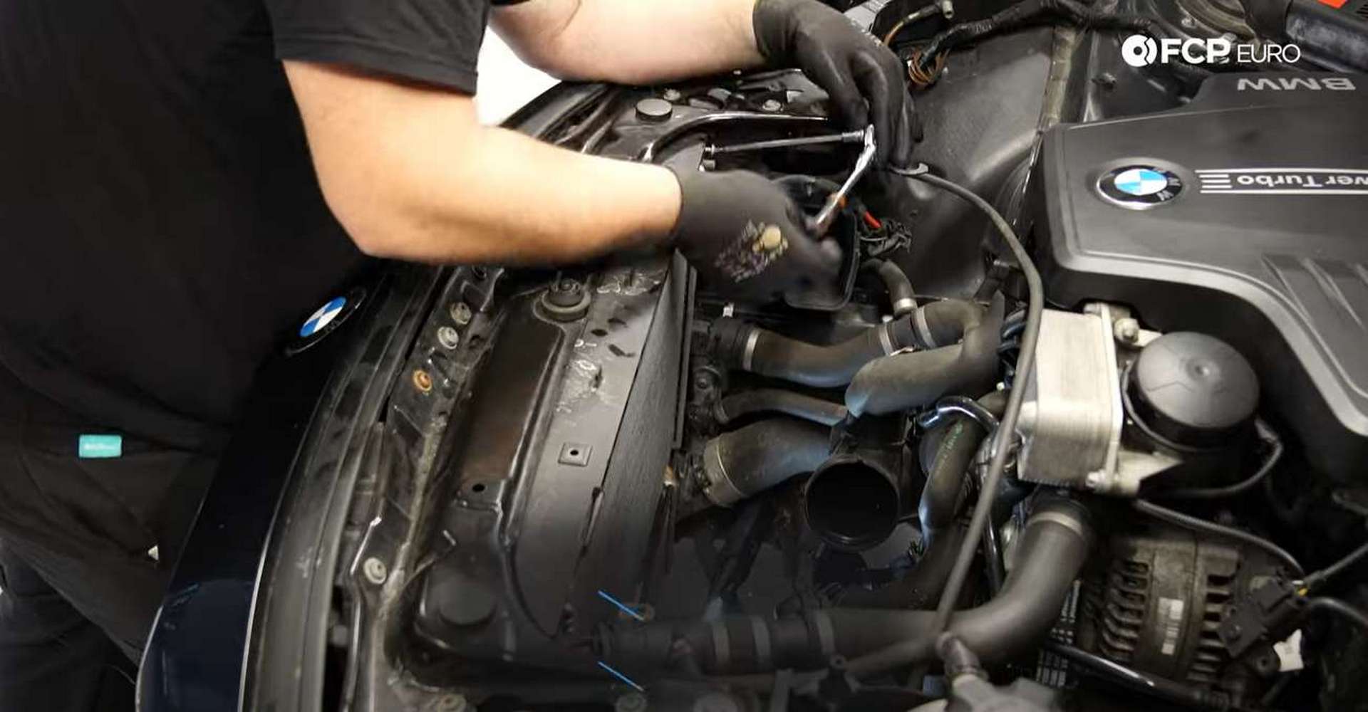 DIY BMW F30 Radiator Replacement loosening the water pump’s hose clamp