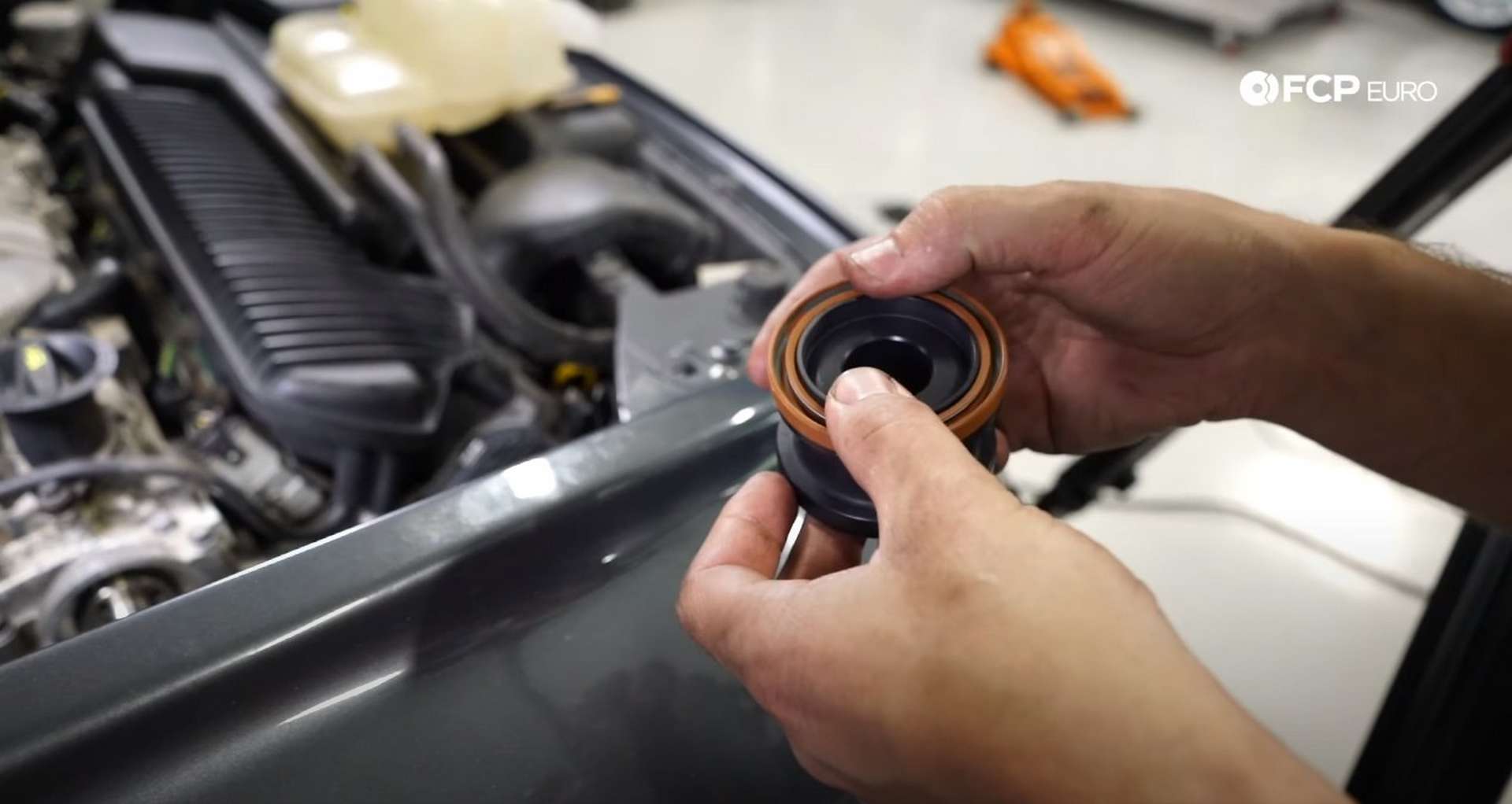 DIY Volvo P1 Timing Belt Replacement installing the new camshaft seal onto the installation tool