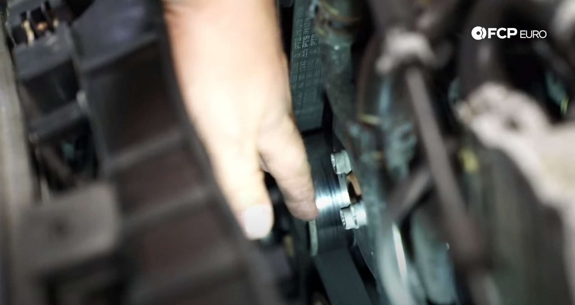 DIY Audi B8.5 Water Pump and Thermostat Replacement removing the fastener behind the headlight