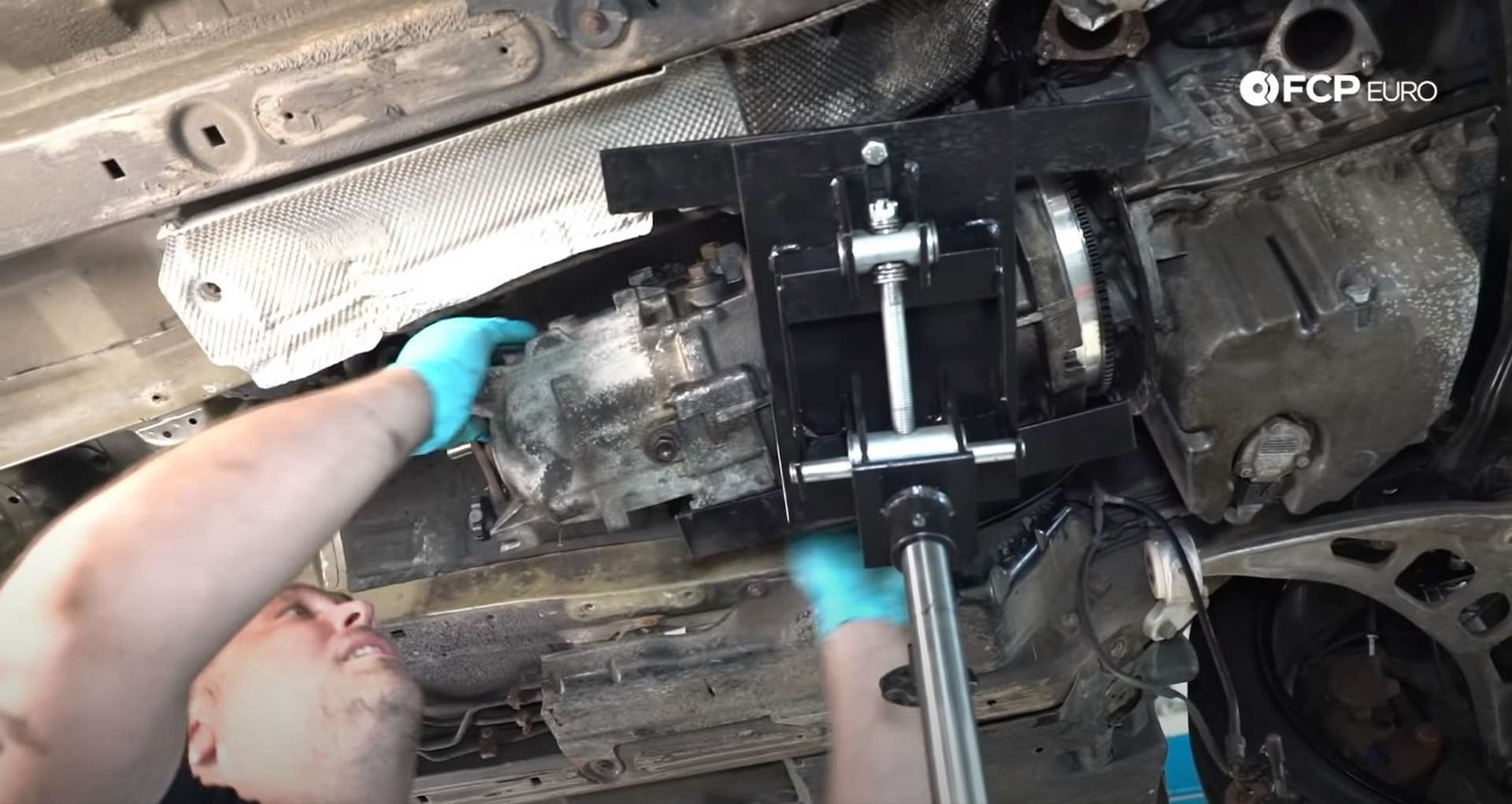 DIY BMW E46 Clutch Replacement reinstalling the transmission