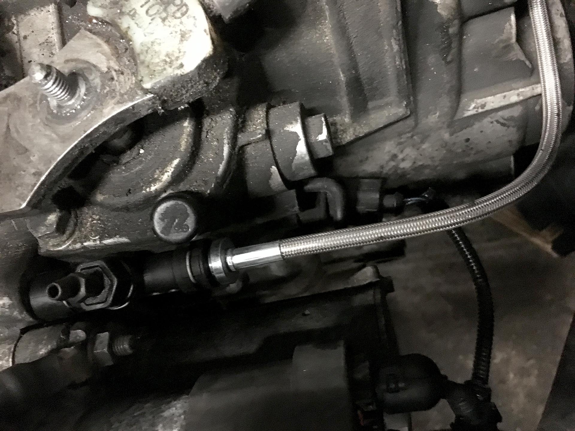 19_VW GTI Stainless steel clutch line installed with factory bleeder block