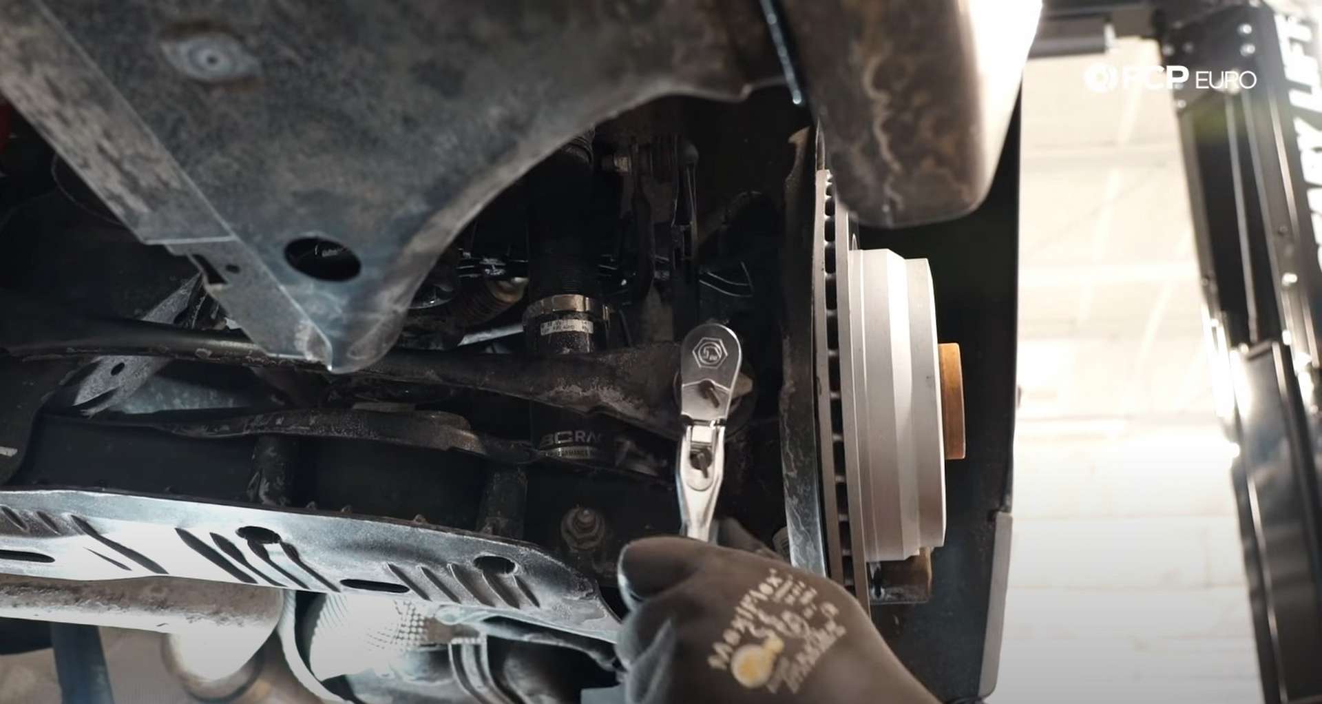 DIY BMW F30 Rear Control Arm Replacement removing outer toe link bolt