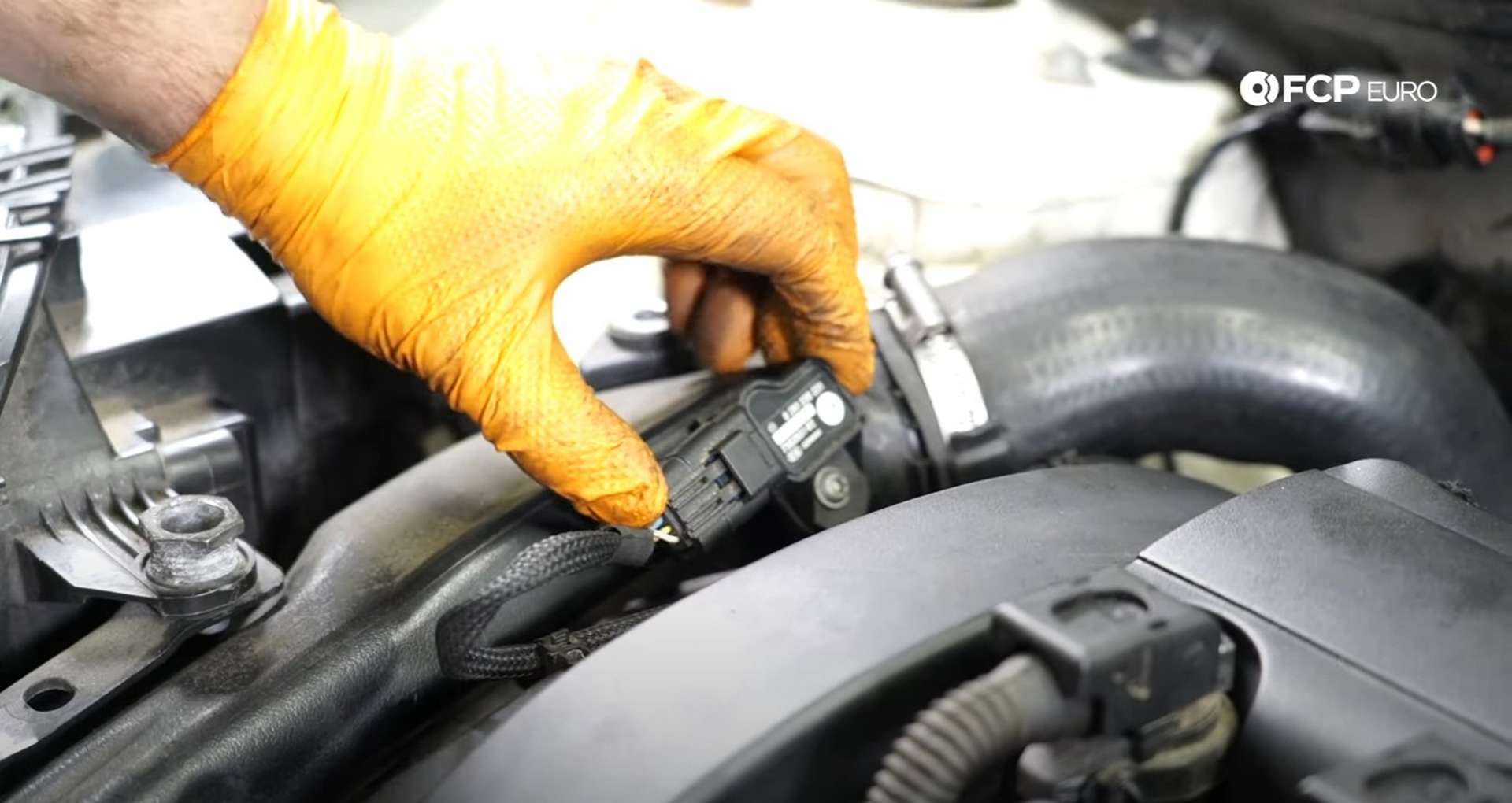 DIY MINI R56 Timing Chain Replacement reconnecting charge pipe sensor