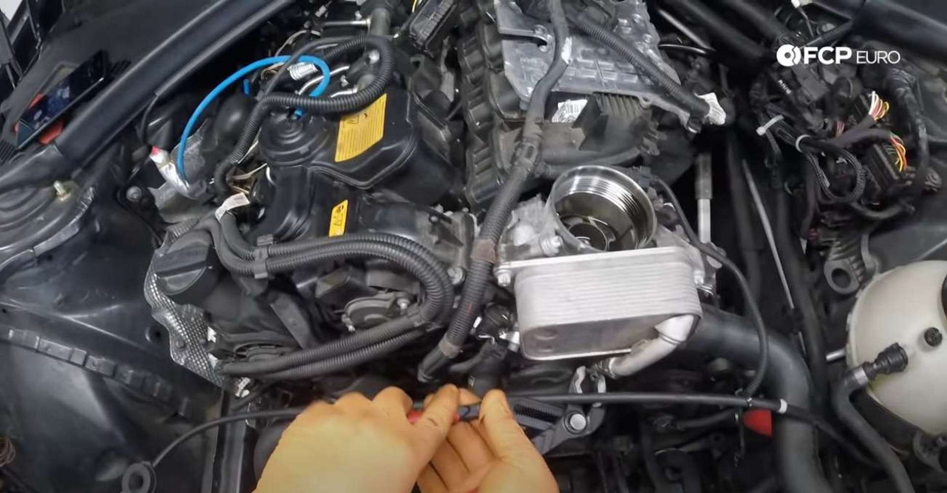 DIY BMW F30 Oil Filter Housing Gasket Replacement disconnecting oil cooler line
