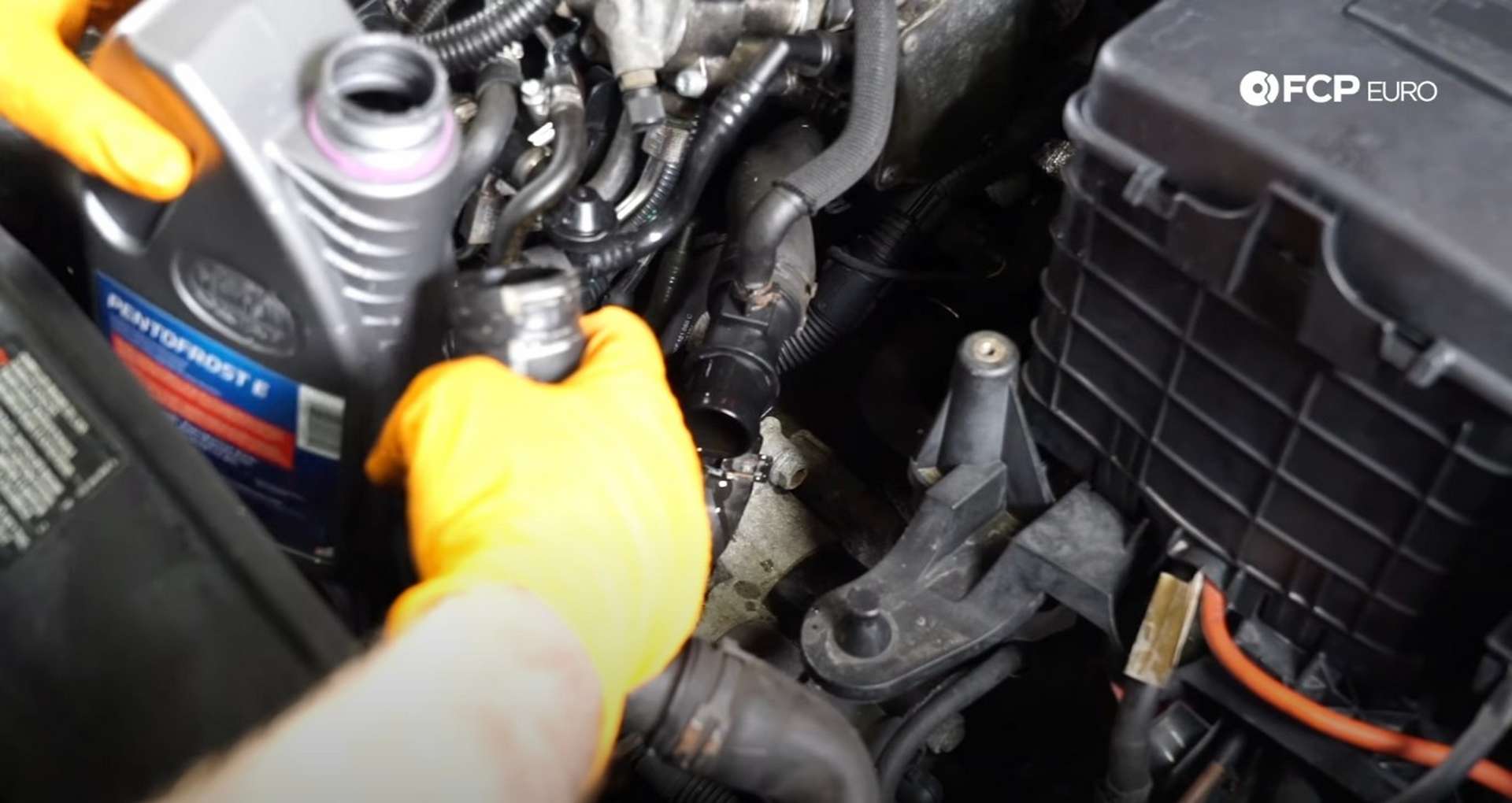 DIY VW GTI Mk5 Oil FIlter Housing filling the radiator