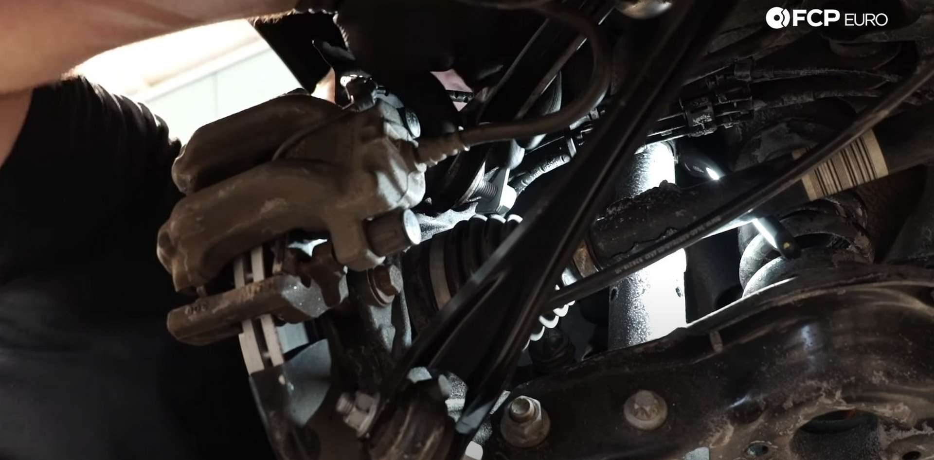DIY BMW F30 Rear Control Arm Replacement installing the outer bolt