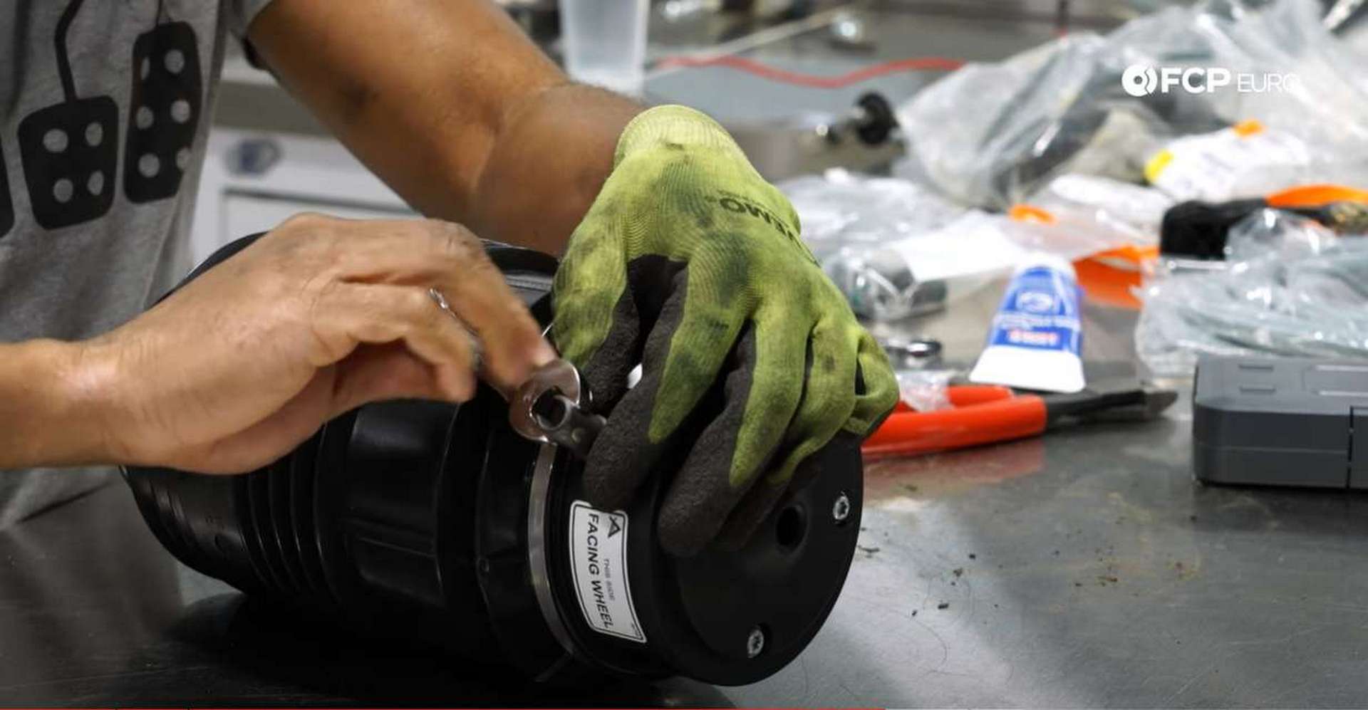 DIY Mercedes AIRMATIC Spring Replacement tightening the fitting with the socket and wrench