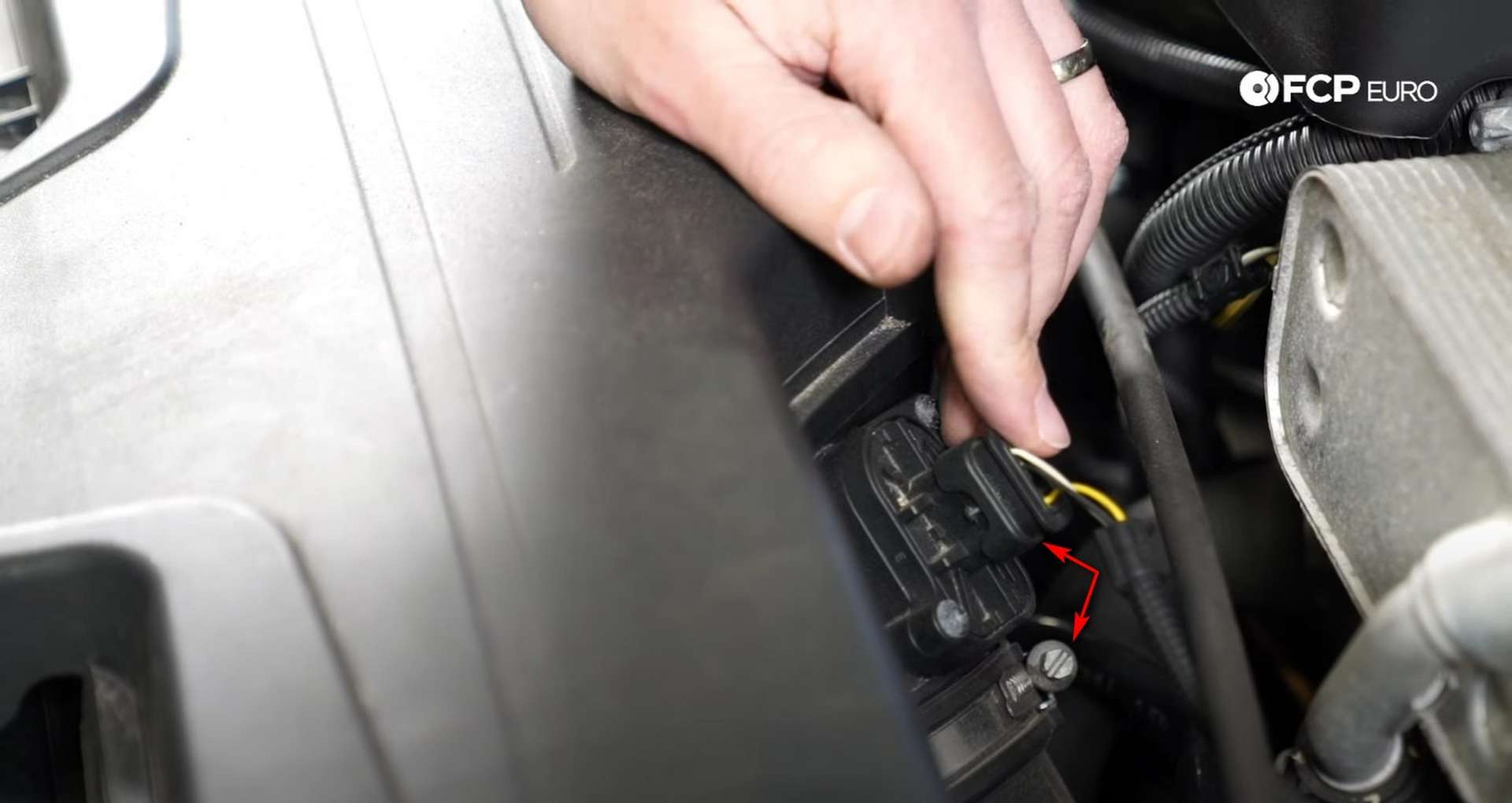 DIY BMW F30 Air Filter Replacement disconnecting the intake tube and MAF