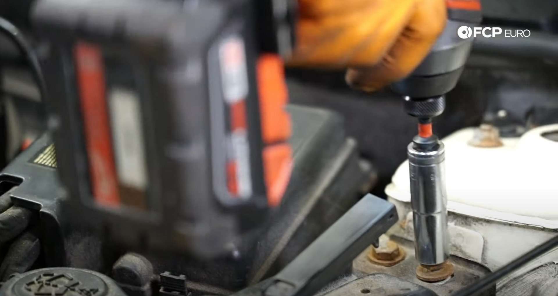 DIY MINI R56 Timing Chain Replacement securing the U-brace to the chassis