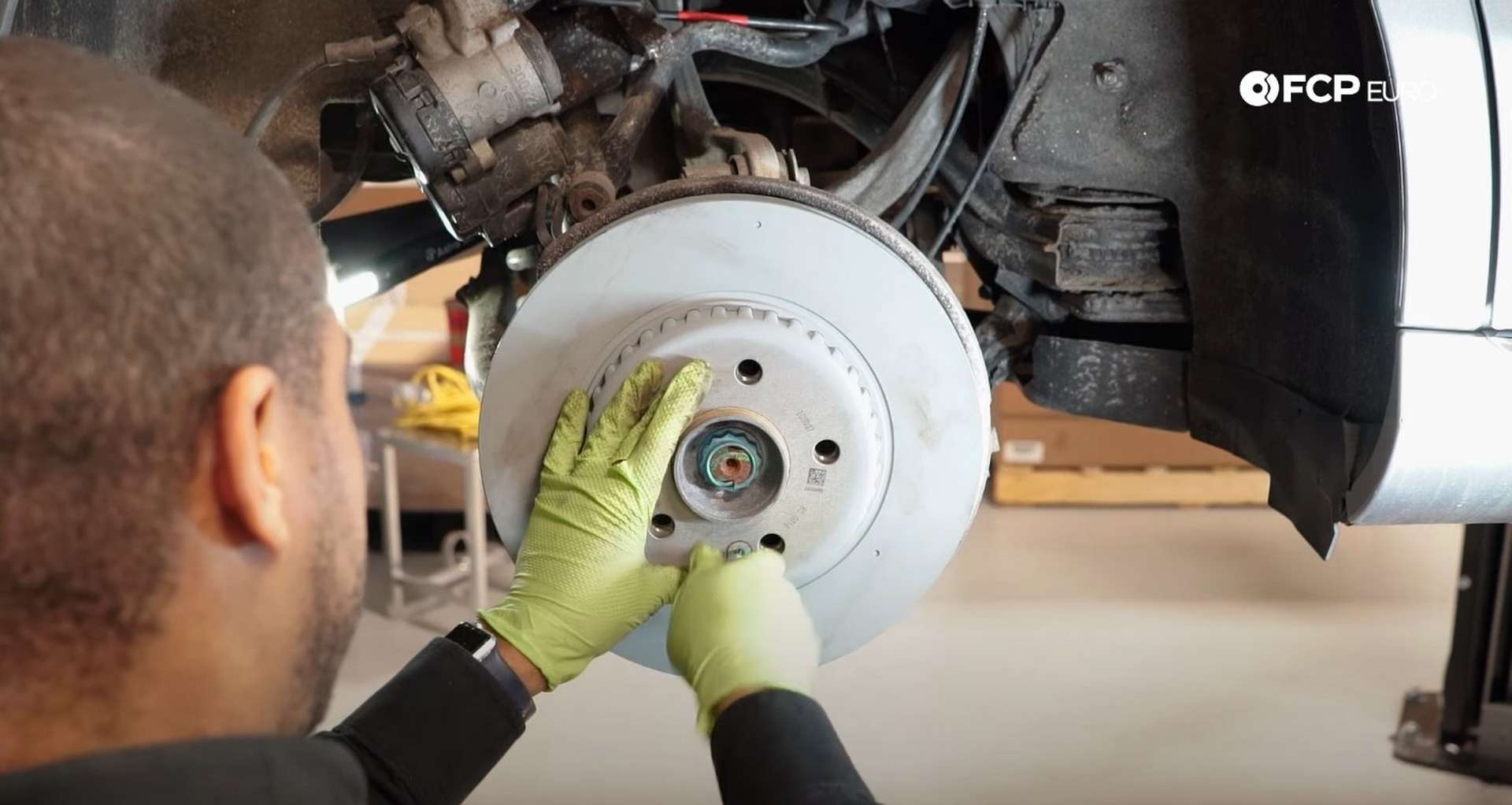DIY Mercedes W205 Rear Brake Service securing the new rotor