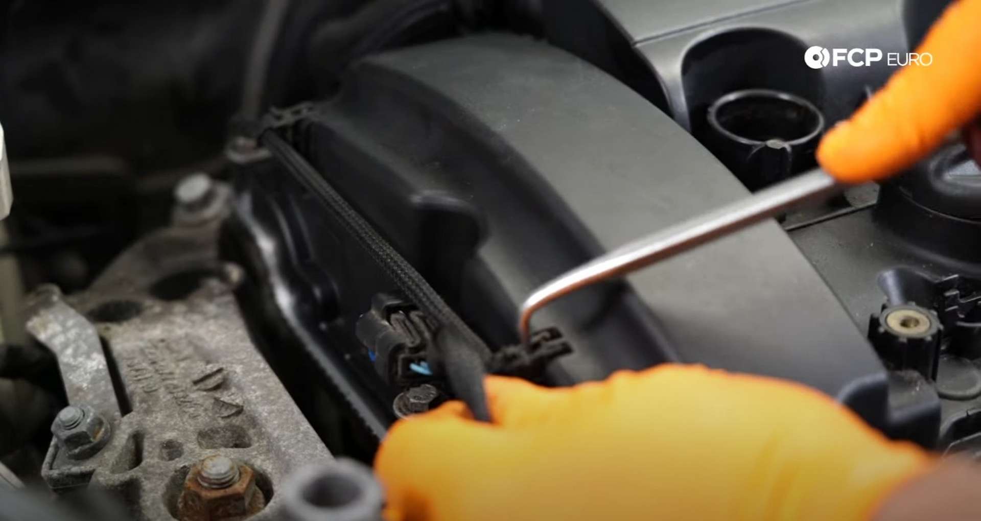 DIY MINI R56 Timing Chain Replacement removing the final piece from the valve cover