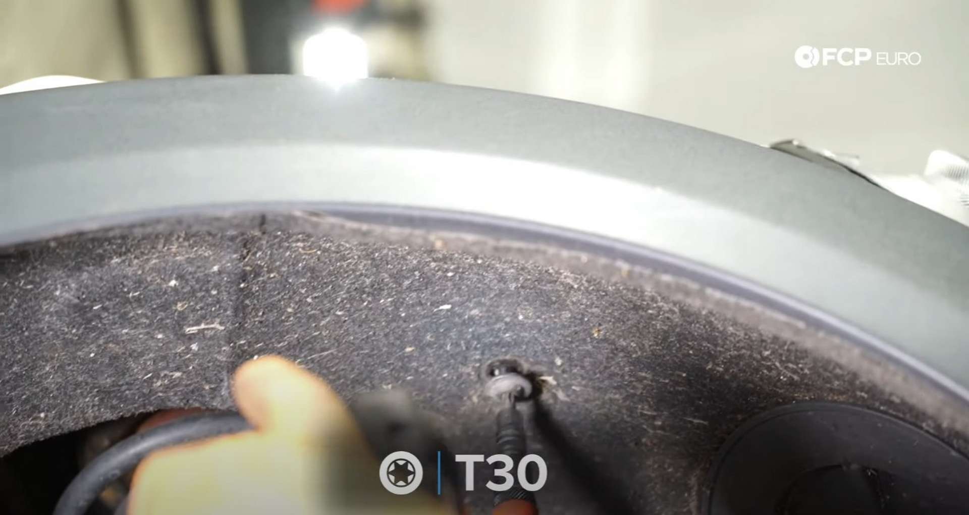DIY MINI R56 Timing Chain Replacement tightening the fender liner fastener