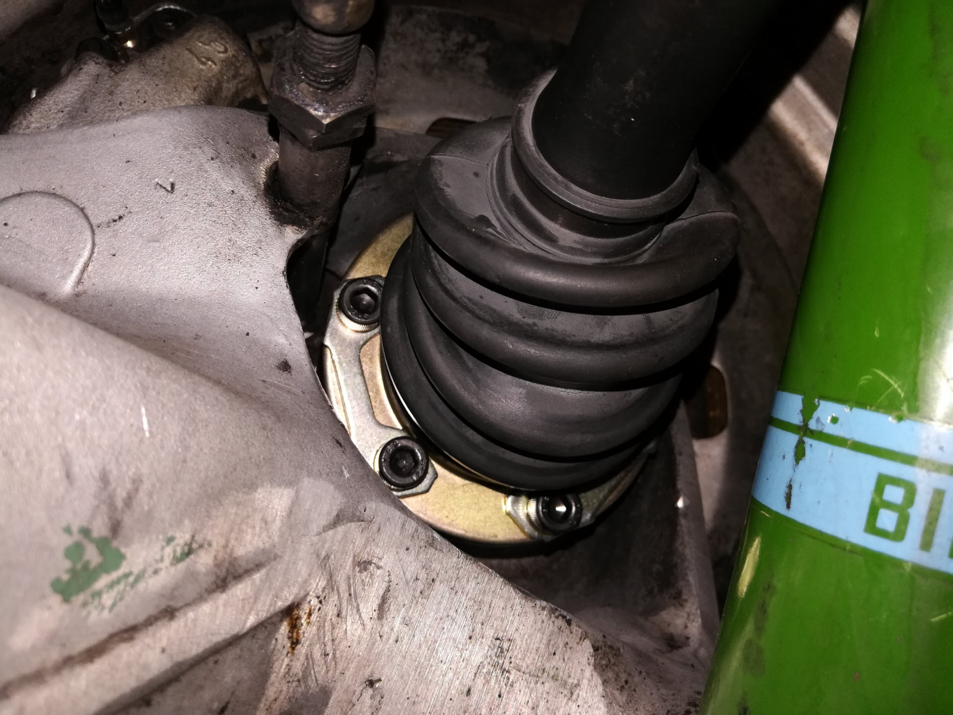 Air-cooled Porsche 911 outer CV joint with mounting hardware.