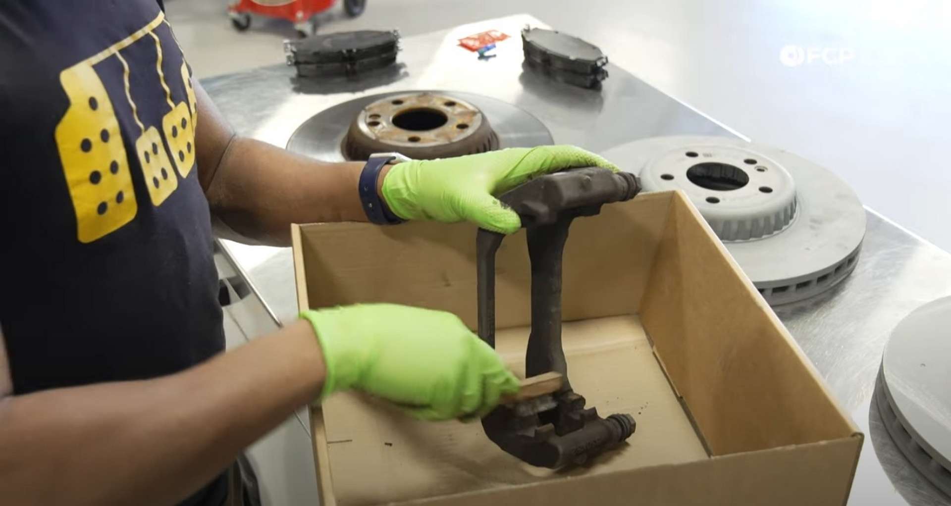 DIY Mercedes-Benz W205 Front Brake Service cleaning the caliper bracket
