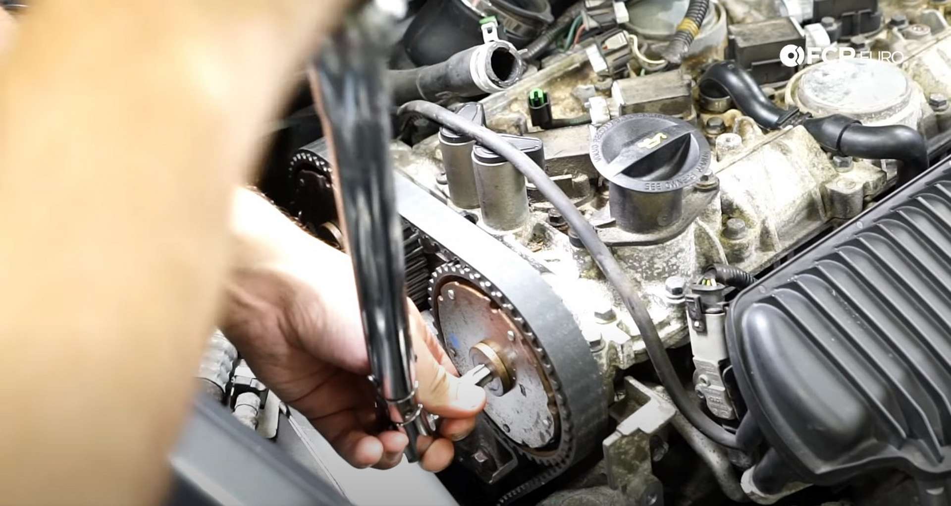 DIY Volvo P1 Timing Belt Replacement torquing the cam sprocket plugs
