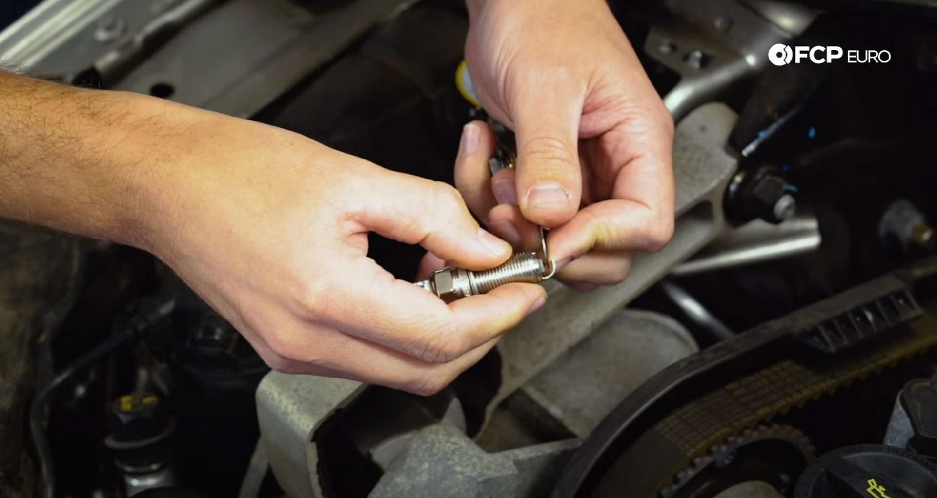 DIY Volvo Spark Plug and Ignition Coil Replacement tightening the spark plug gap
