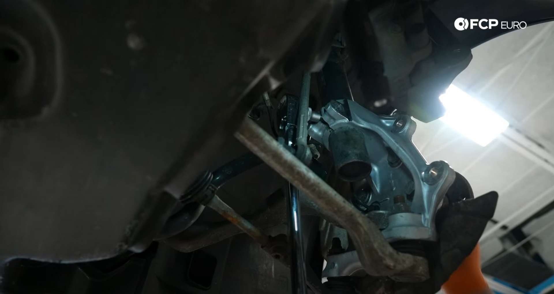 DIY BMW E9X Wheel Bearing Replacement spreading the knuckle
