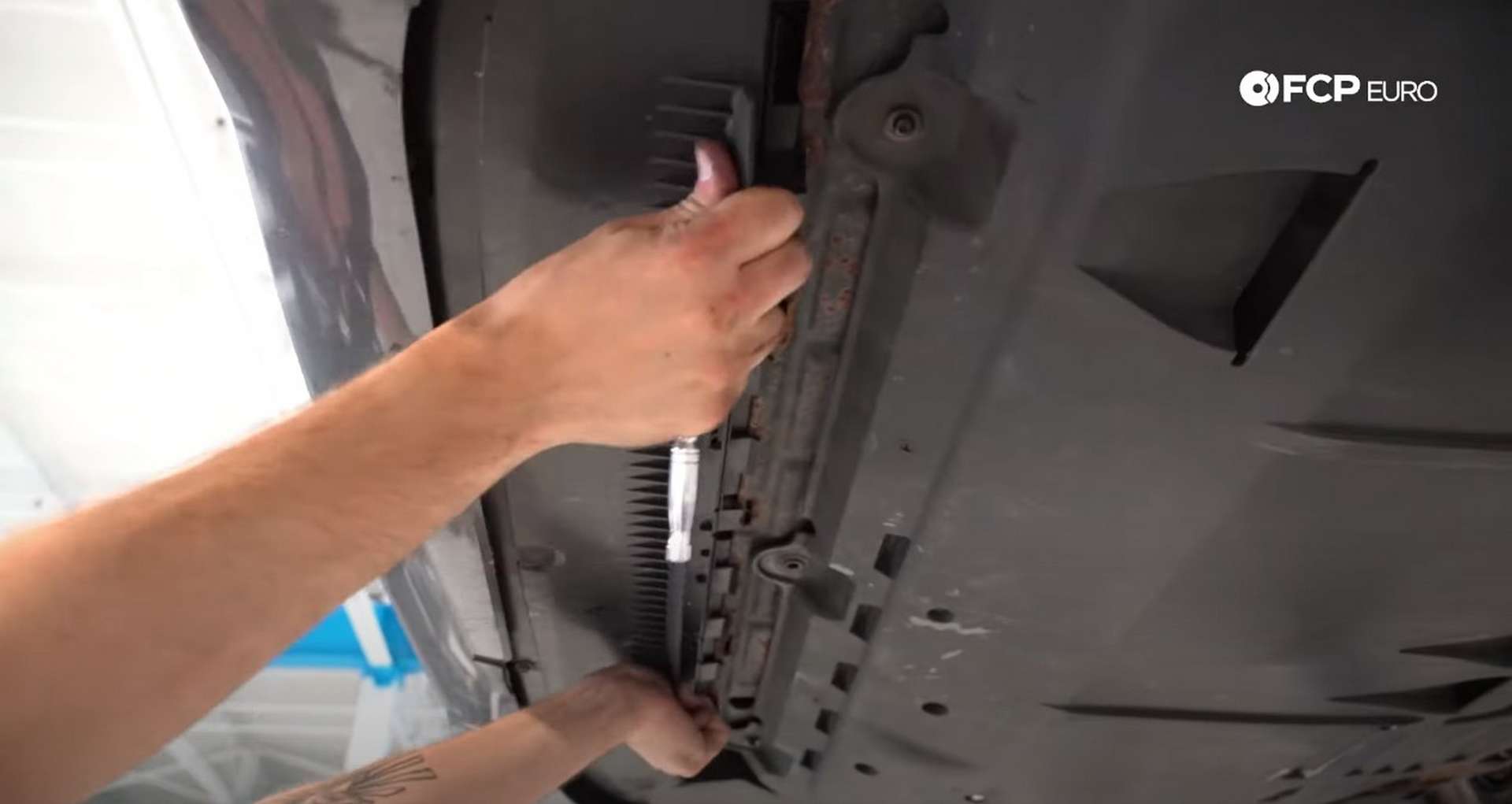 DIY Volvo Alternator and Serpentine Belt Replacement installing the belly pan