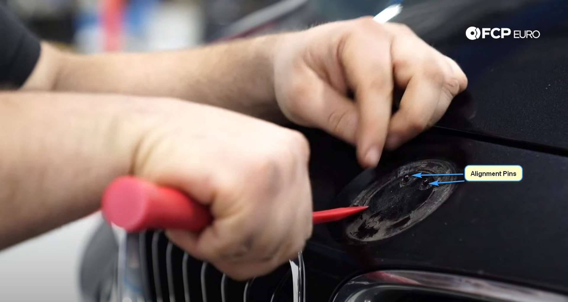 DIY BMW F30 Roundel Replacement removing the adhesive with the scraper