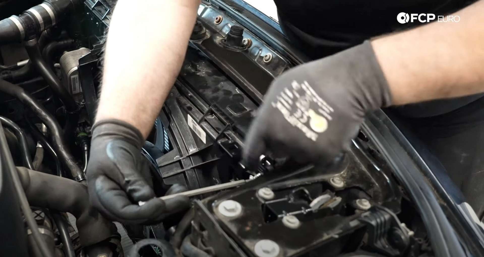 DIY BMW F30 Radiator Replacement securing the fan shroud to the radiator