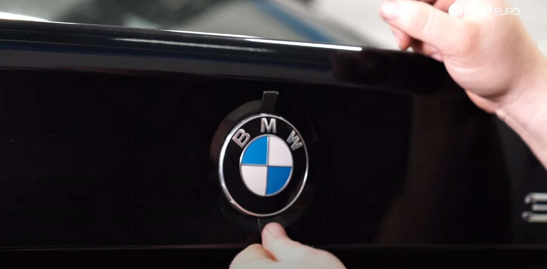 DIY BMW F30 Roundel Replacement sliding the strap through the roundel