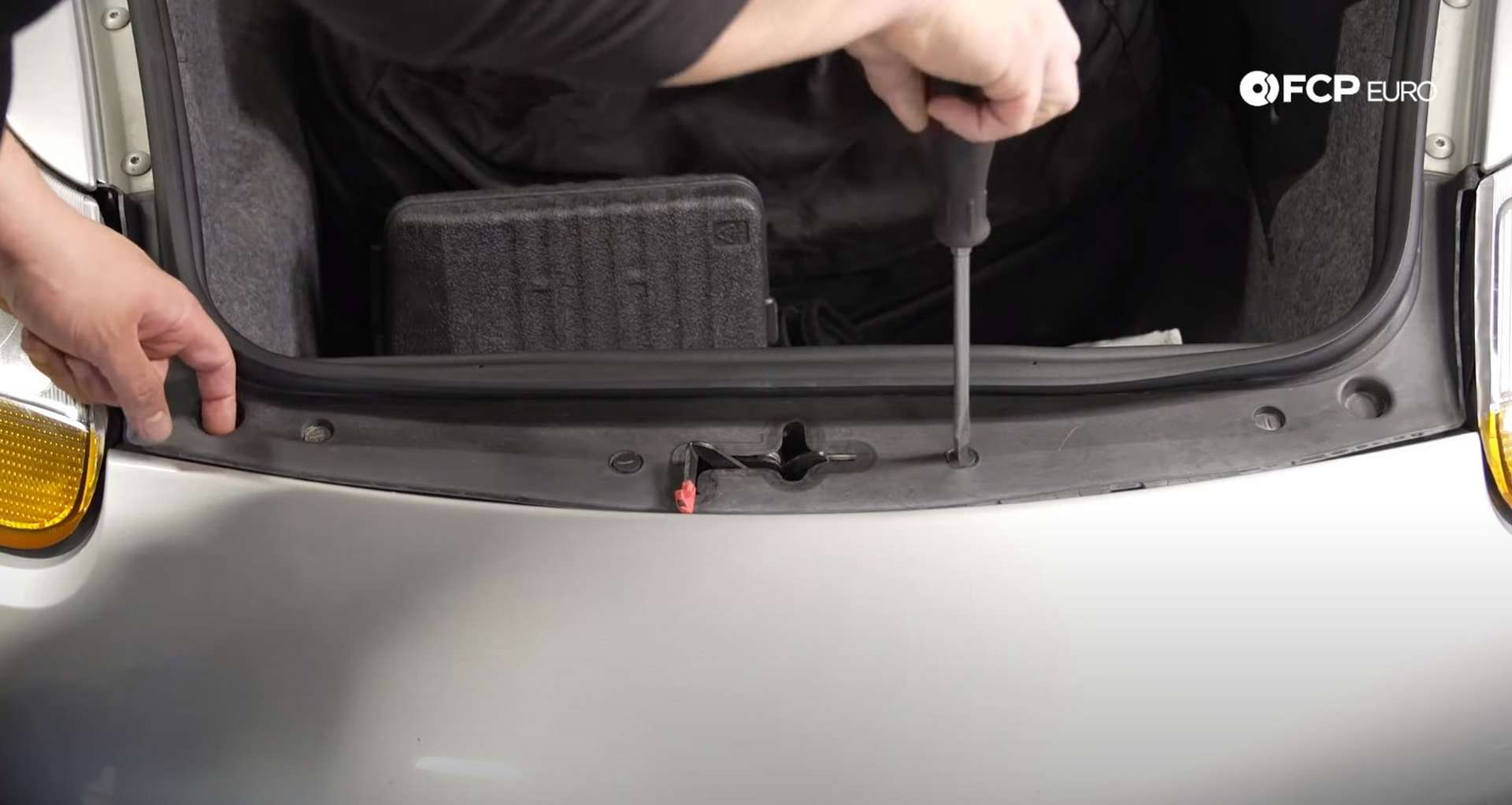 DIY Porsche 996 Radiator Replacement unlocking trim panel clips