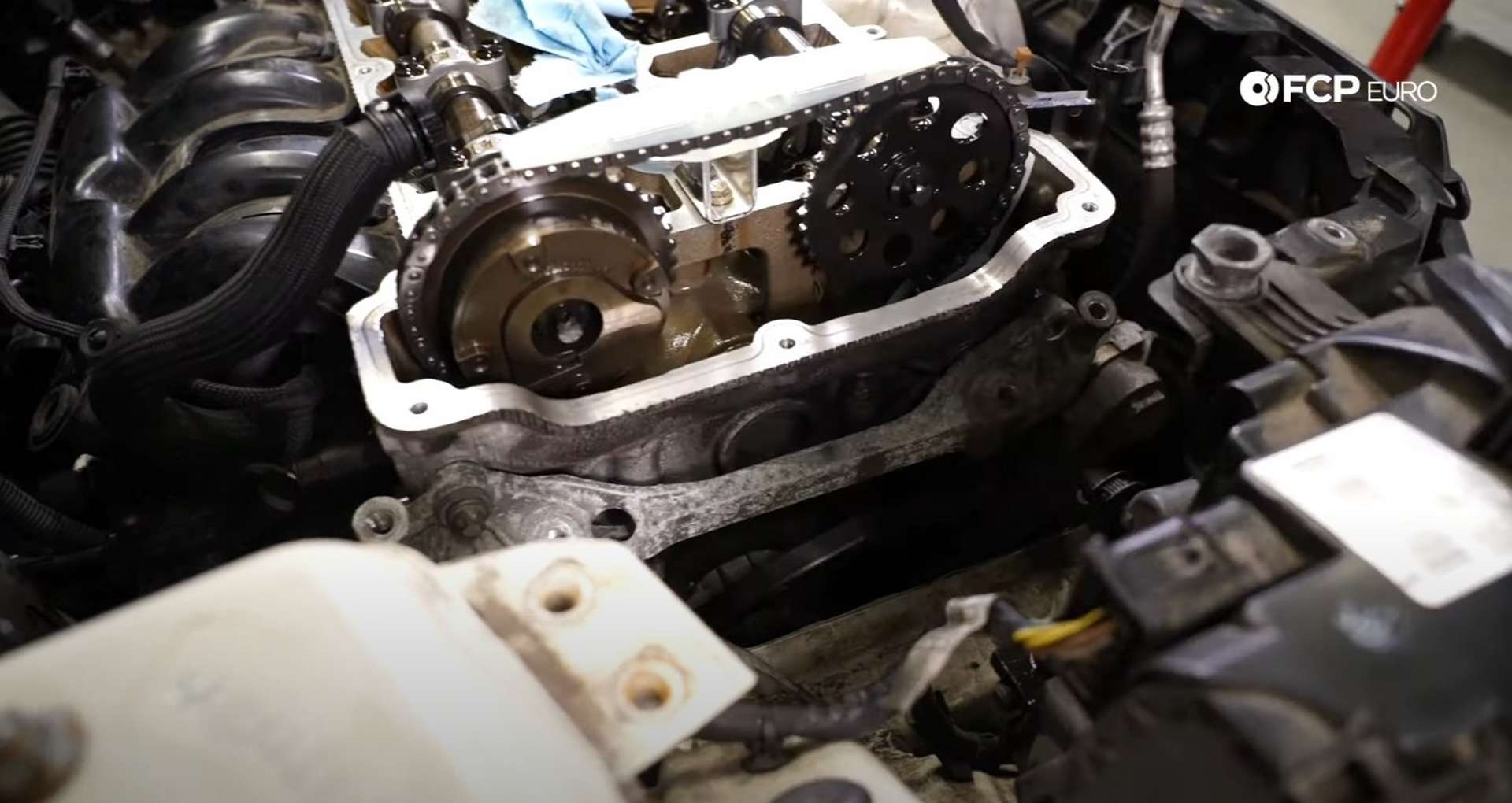 DIY MINI R56 Timing Chain Replacement installing the lower engine mount bracket