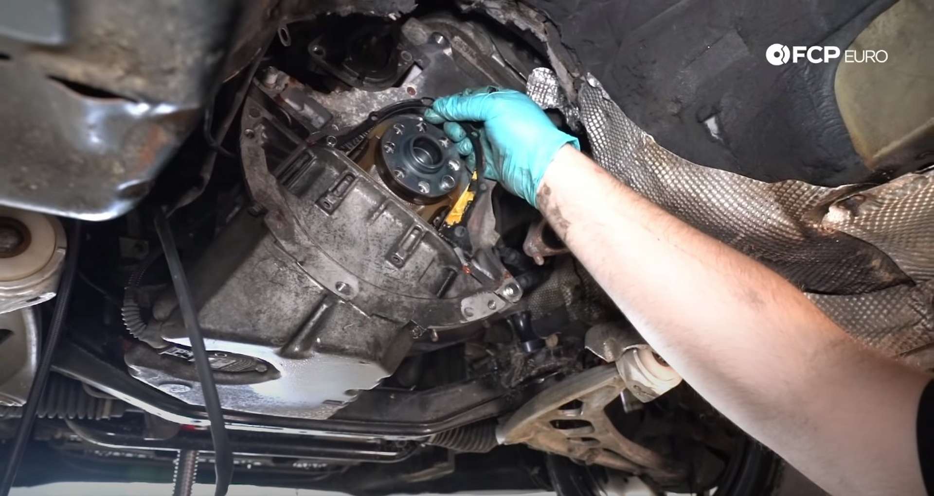 DIY BMW E46 Clutch Replacement removing the rear main seal housing gasket