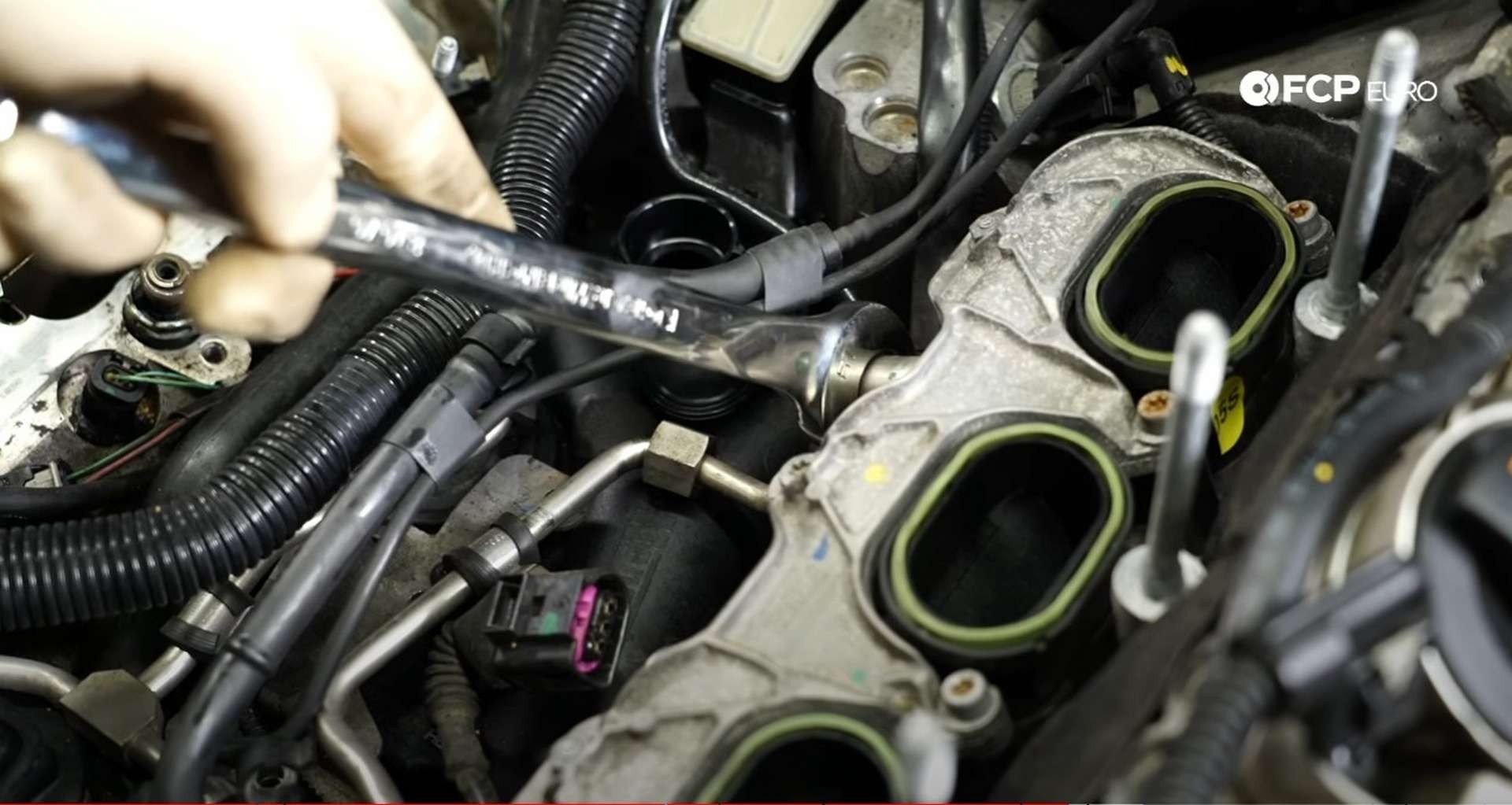 DIY Audi 3.0T PCV/AOS Replacement installing the intake manifold fuel line fitting