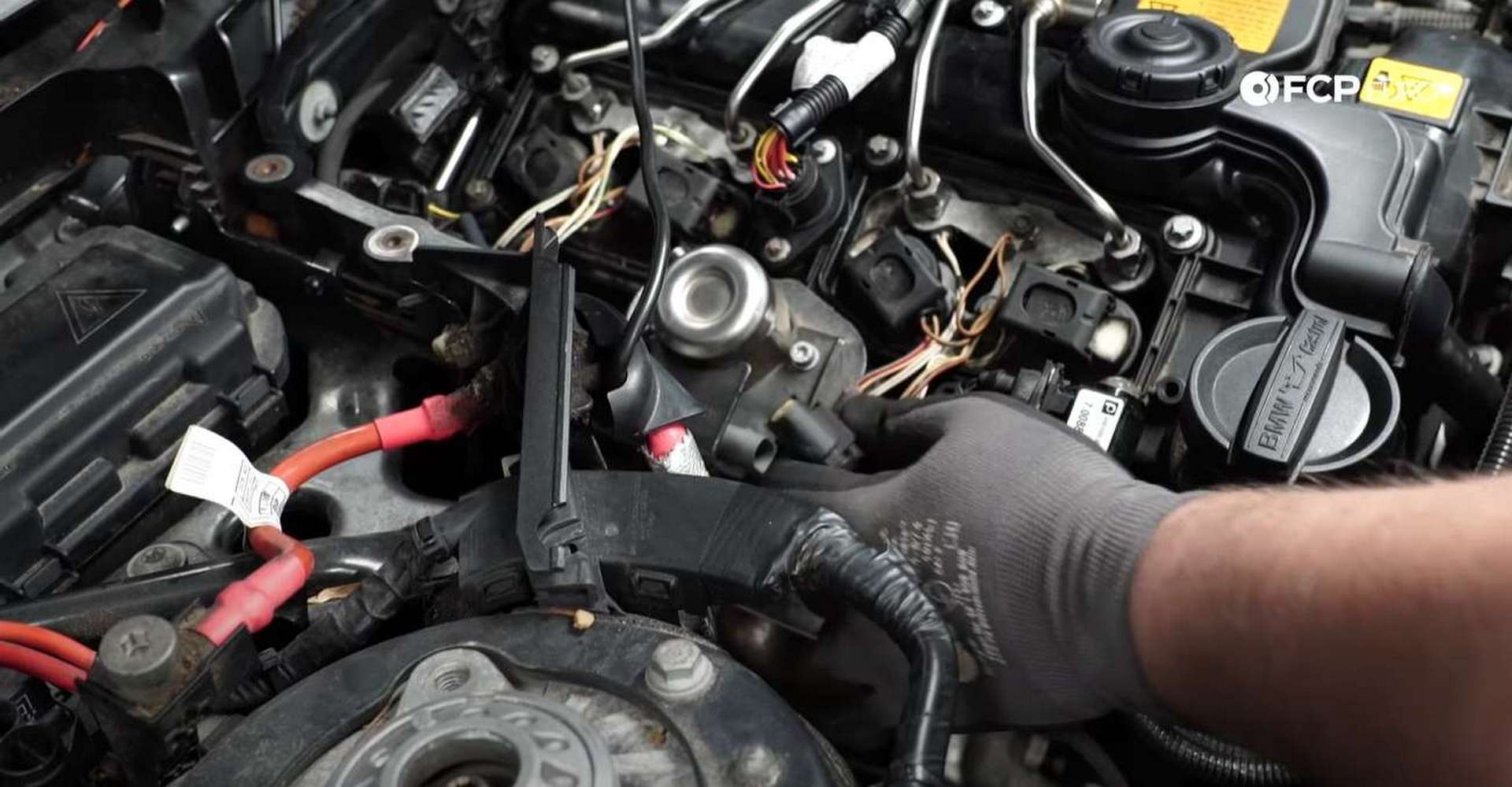 DIY BMW F30 High-Pressure Fuel Pump Replacement disconnecting the wiring harness from the fuel pump
