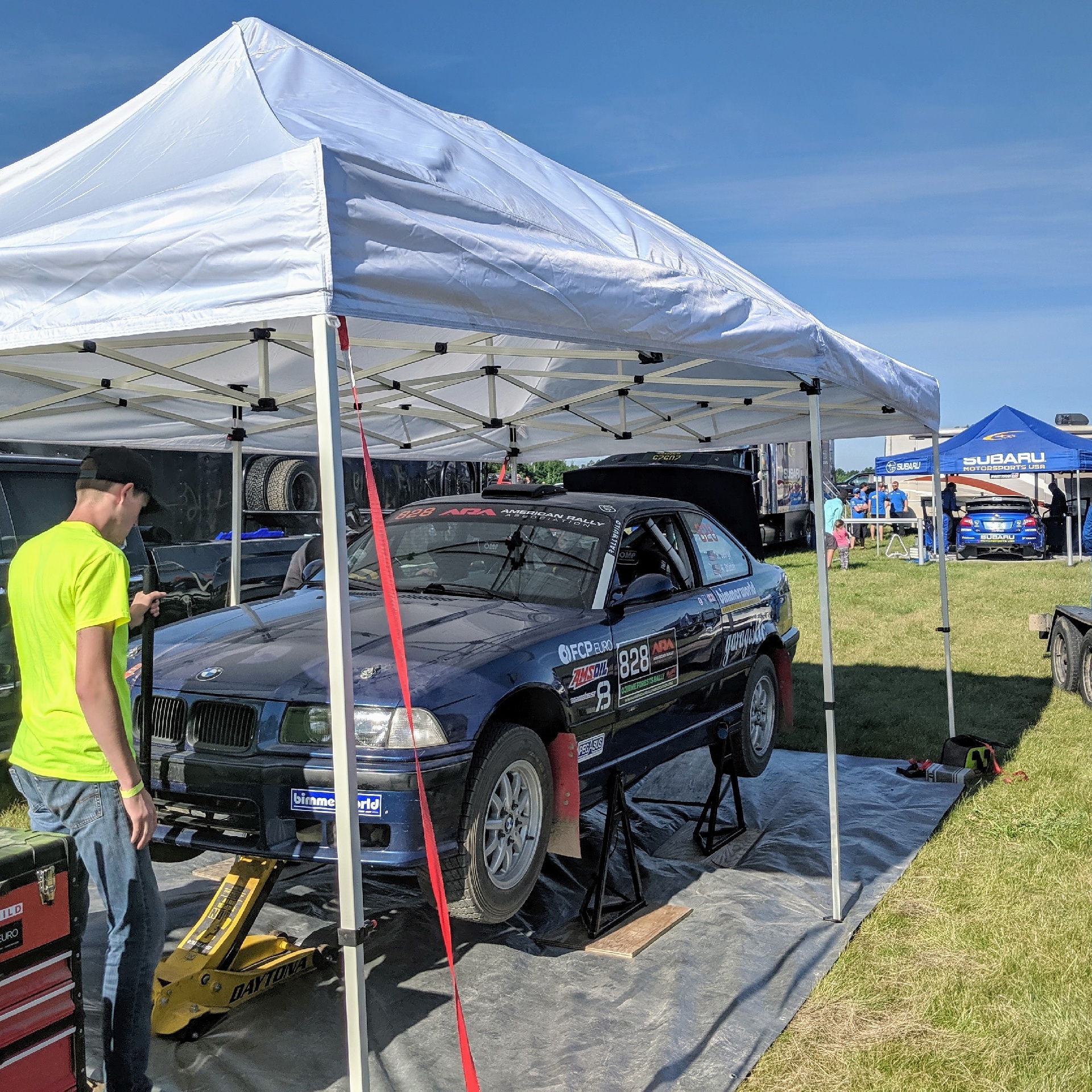 Bearded Ryno Rally Team Ojibwe Forest Rally Service on Pin Stands BMW M3 E36