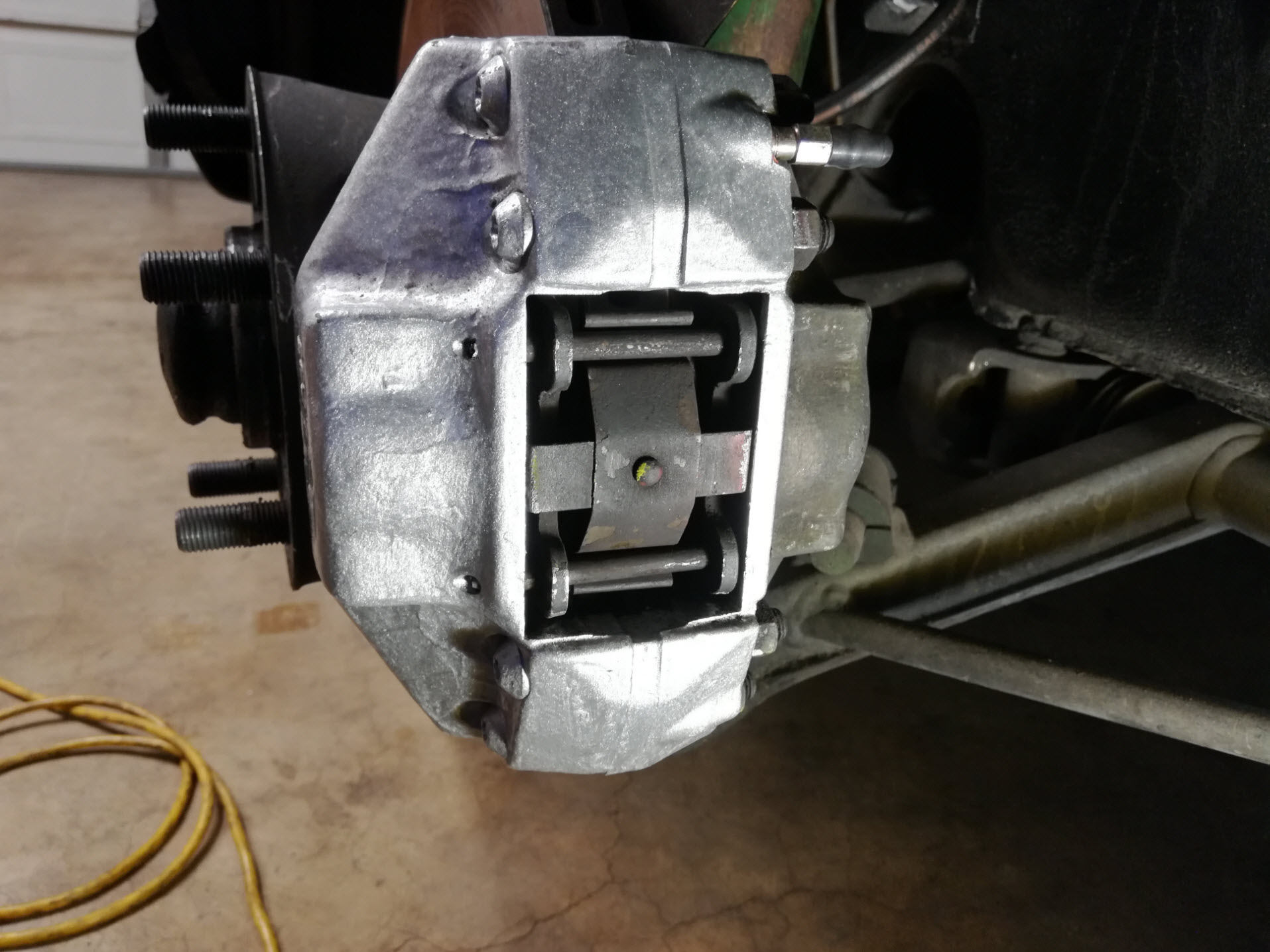 Air-cooled Porsche 911 front brake caliper assembly complete.