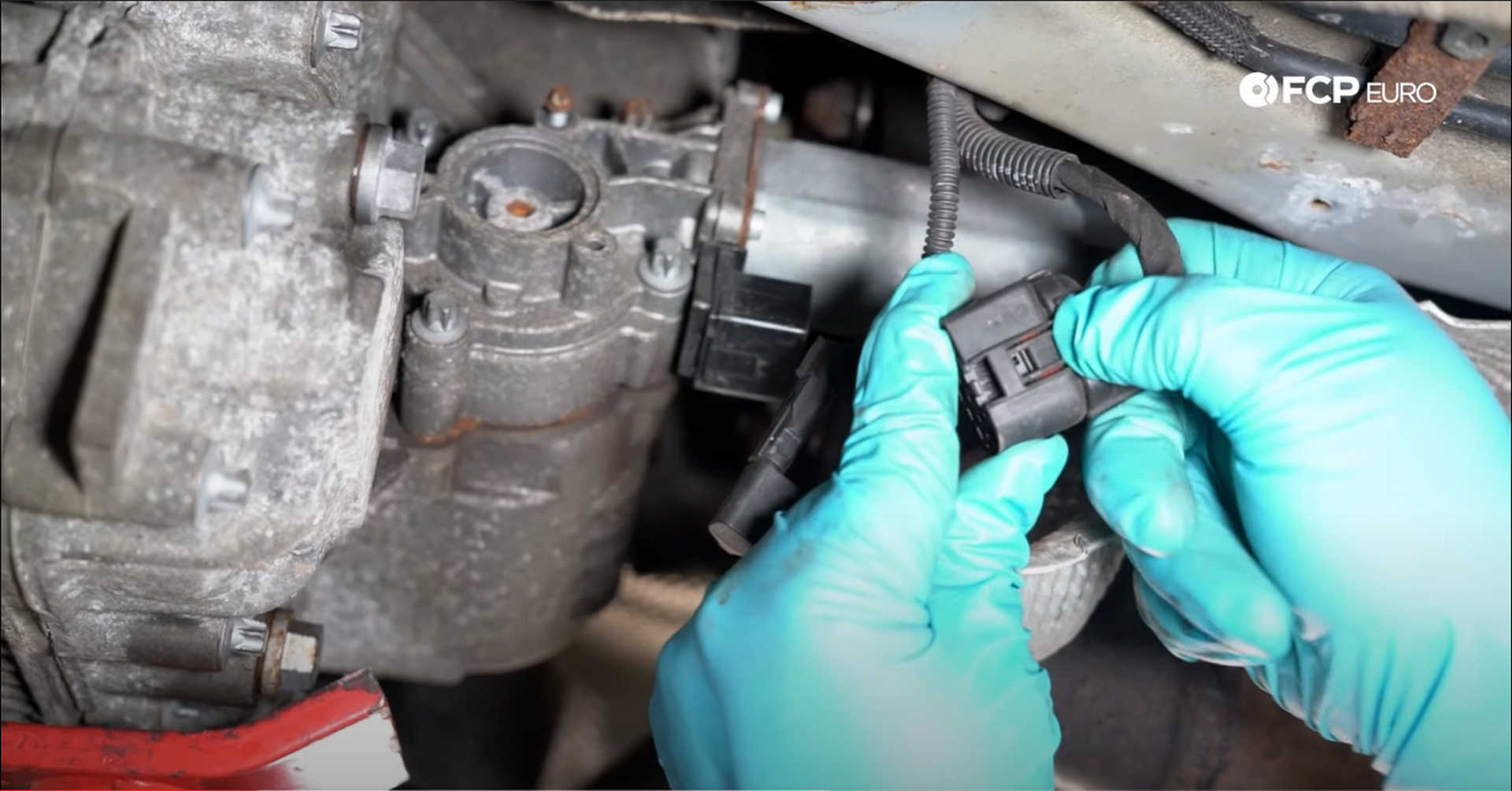 DIY BMW X3 Transfer Case Actuator unplugging the transfer case electrical connection