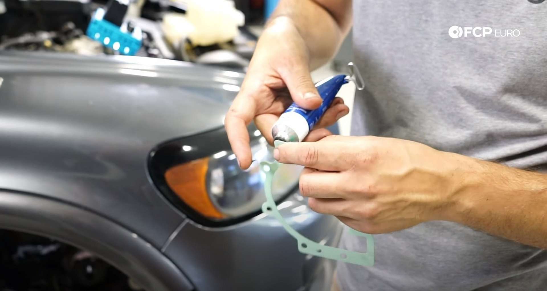 DIY Volvo P1 Water Pump Replacement applying the sealant to the water pump gasket