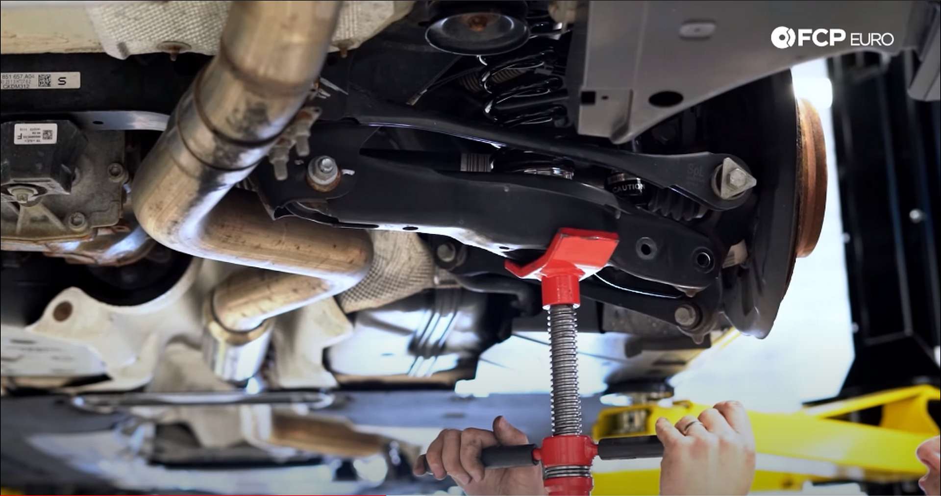 DIY BMW F30 Coilovers compressing spring for installation