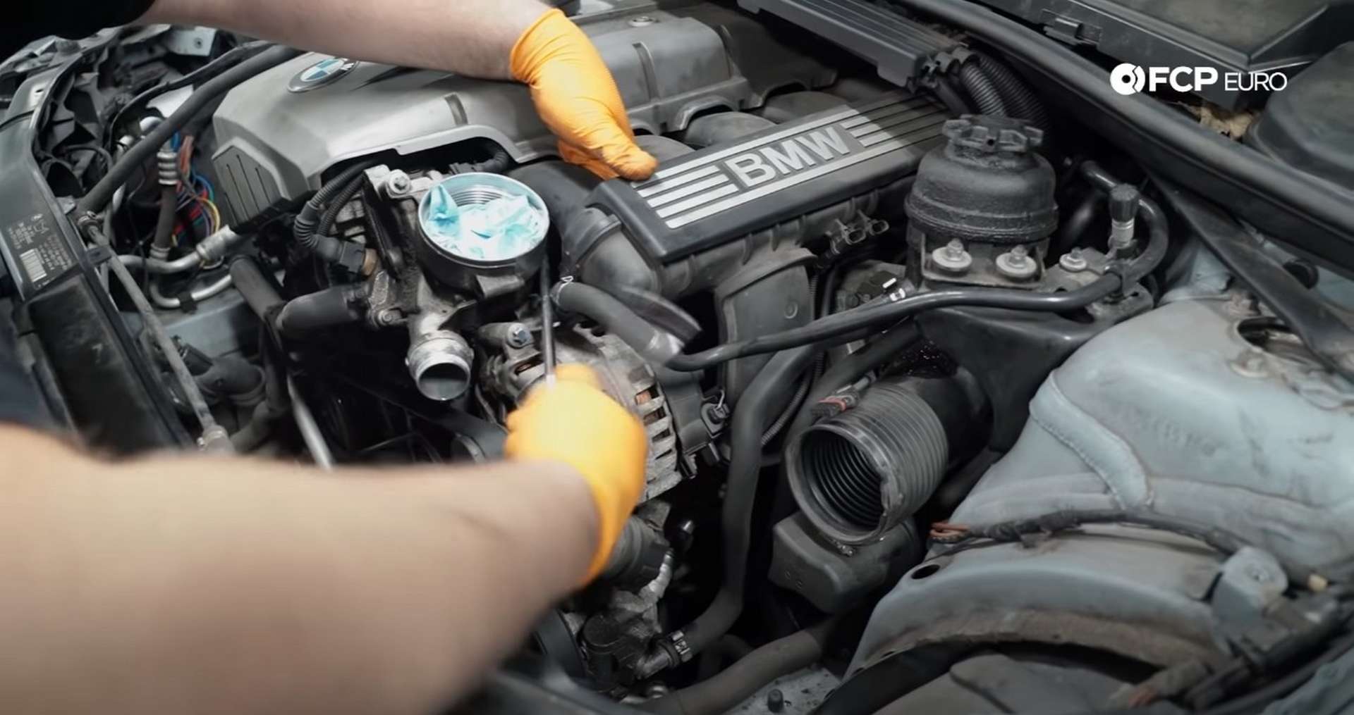 DIY BMW E9X Oil Filter Gasket Replacement removing the filter housing's rear bolt