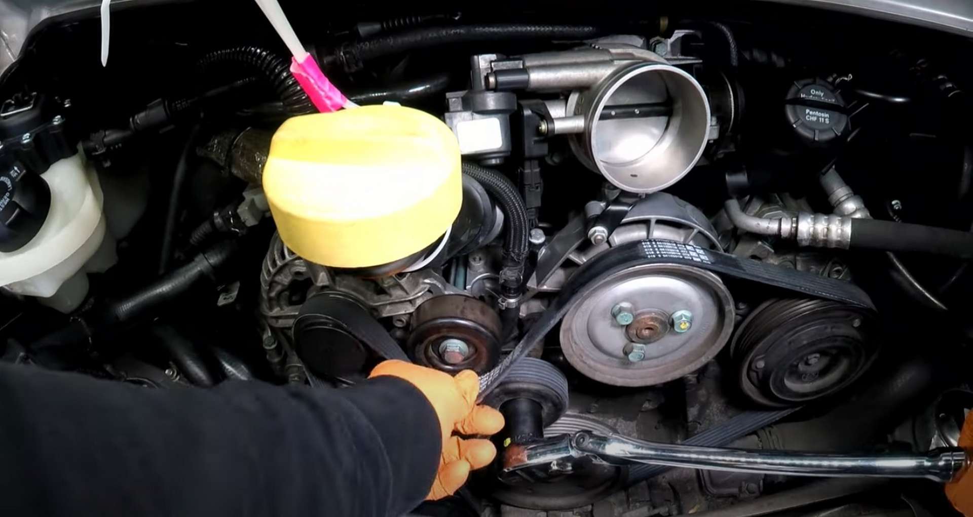 Porsche 996 Water Pump And Thermostat Replacement removing the old belt