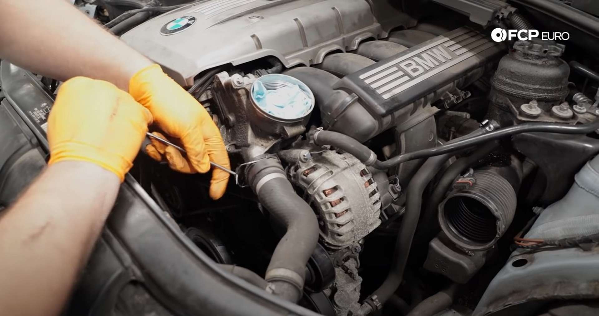 DIY BMW E9X Oil Filter Gasket Replacement removing the upper rad hose