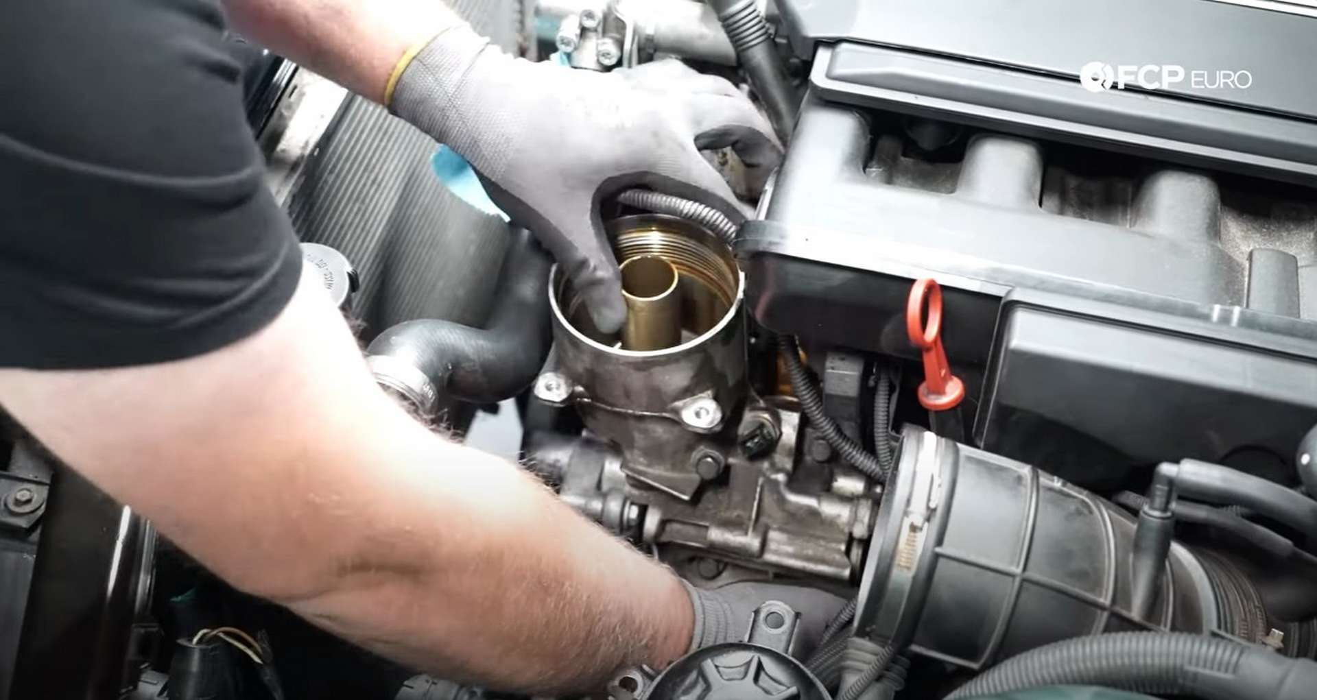 DIY BMW E46 Oil Filter Housing Gasket and VANOS Line Replacement removing the oil filter housing