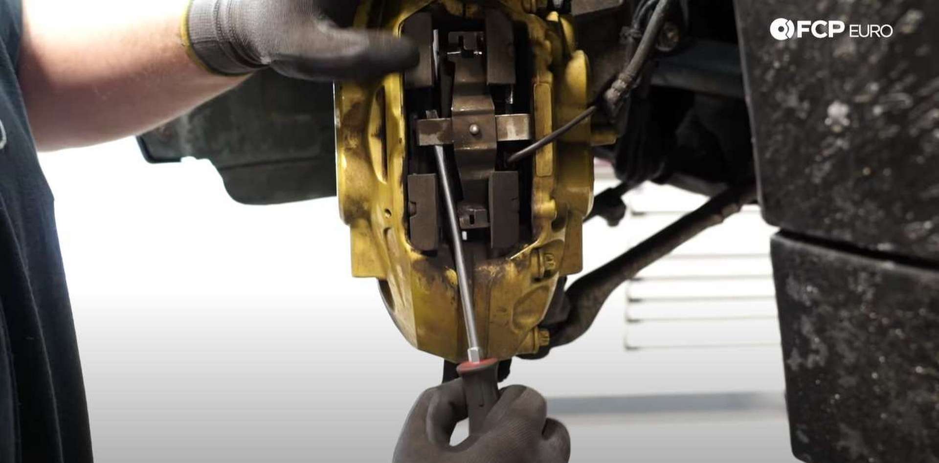 DIY BMW F30 M-Sport Brake Service pulling the anti-rattle clip out