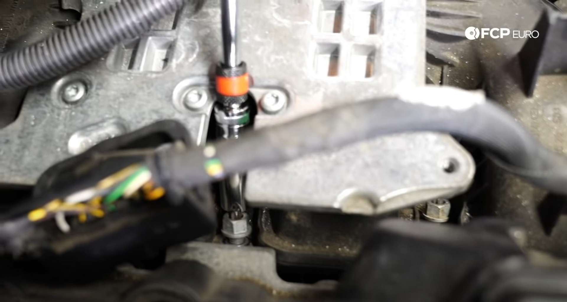 DIY BMW F30 Oil Filter Housing Gasket Replacement bolt tightening the manifold nuts