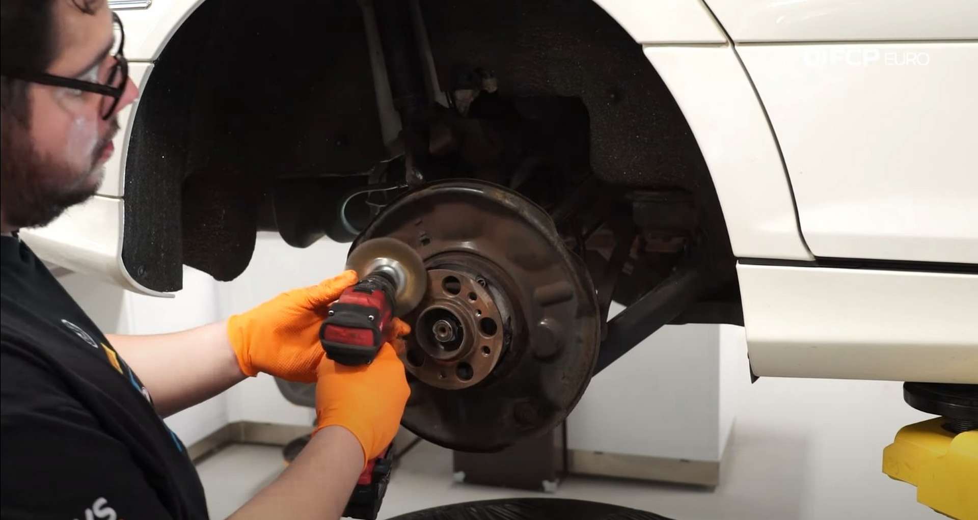 DIY Mercedes-Benz W302 Rear Brake Service caliper cleaning the mounting surface