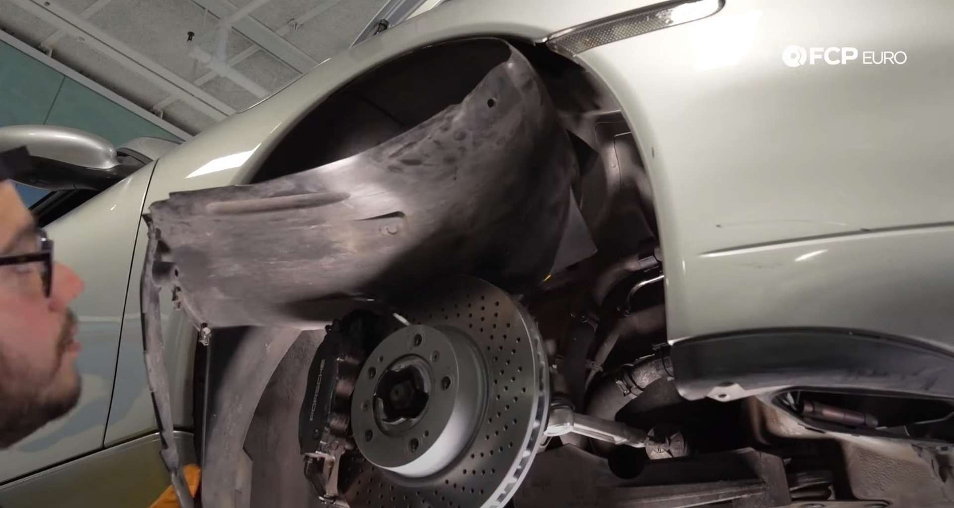 DIY Porsche 996 Radiator Replacement tucking the fender liner back