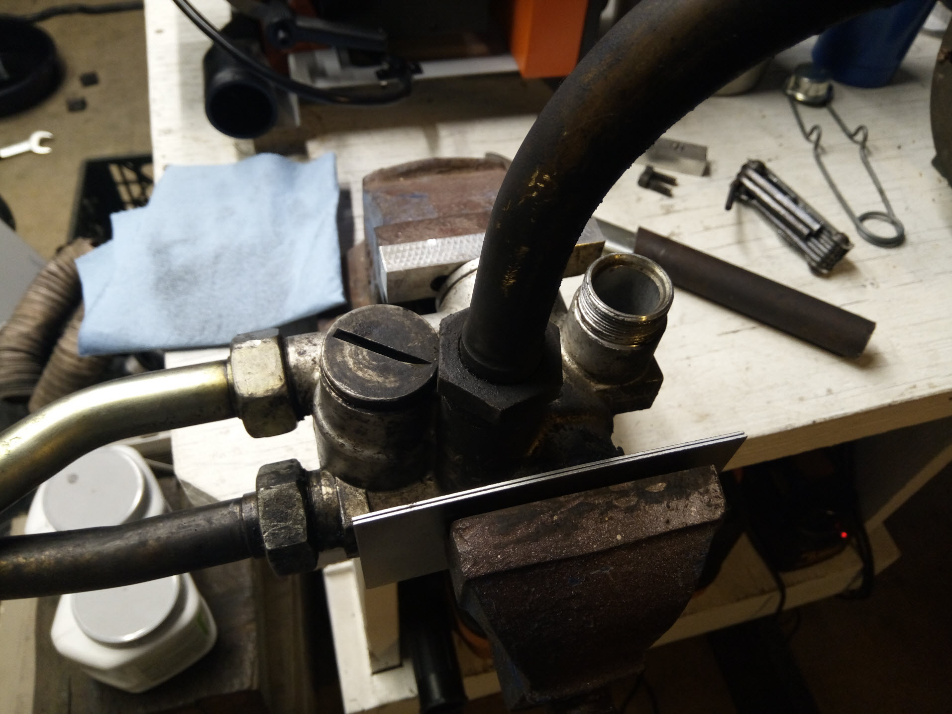 Air-cooled Porsche 911 thermostat oil line removal.