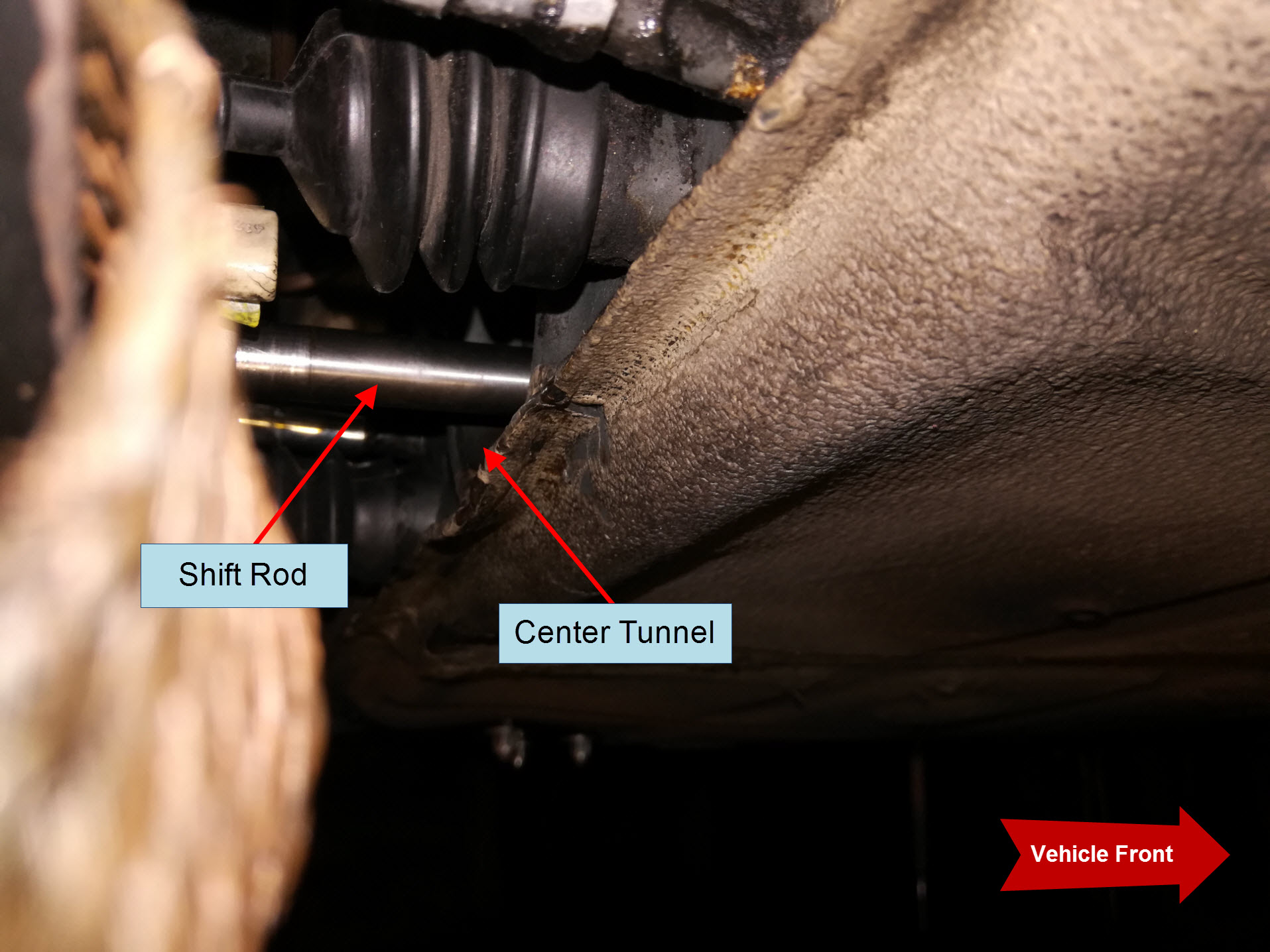 Air-cooled Porsche 911 gearbox shift rod in center tunnel.