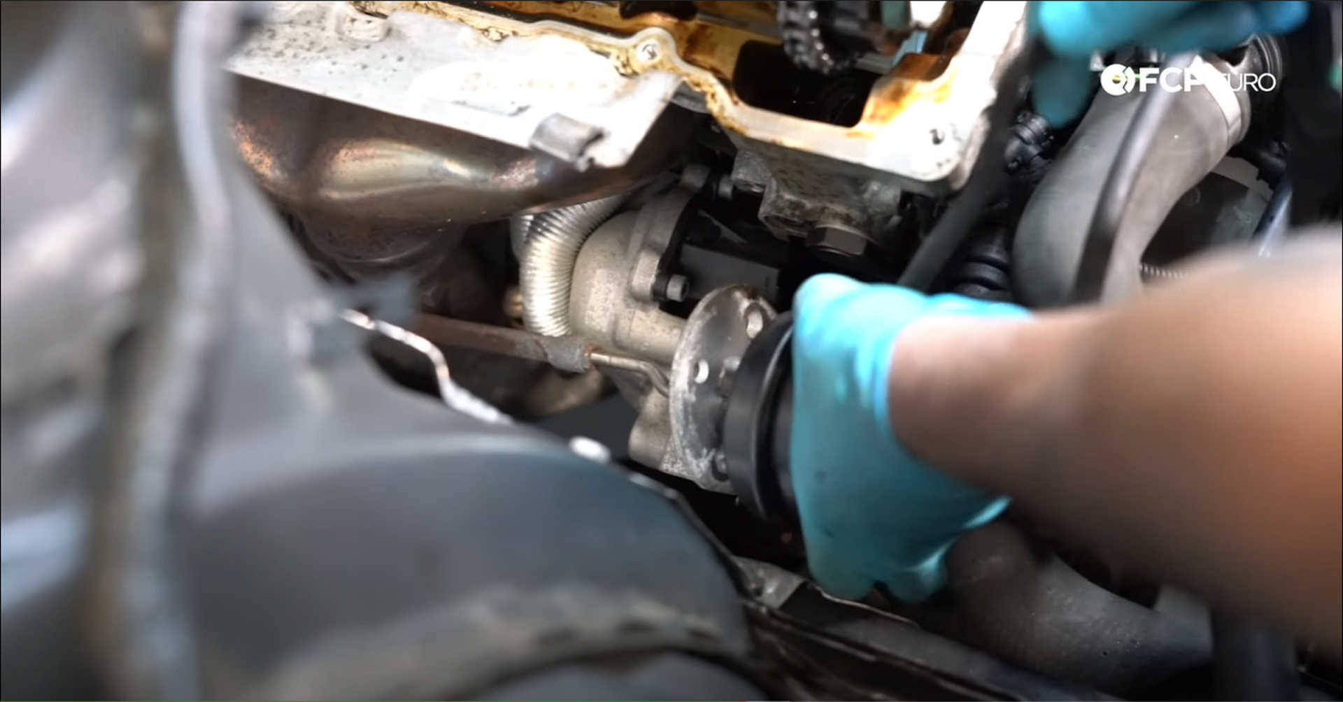 DIY BMW N20 Timing Chain fitting the wastegate actuator into its bracket