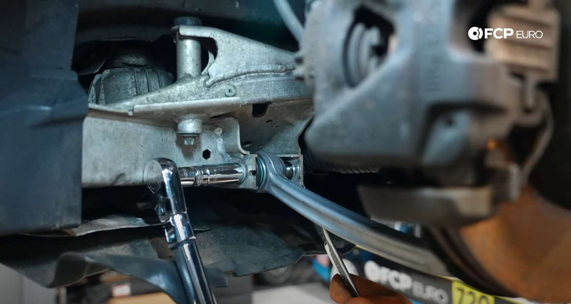 DIY BMW E9X Front Control Arm Upgrade torquing the lower control arm’s inner pivot