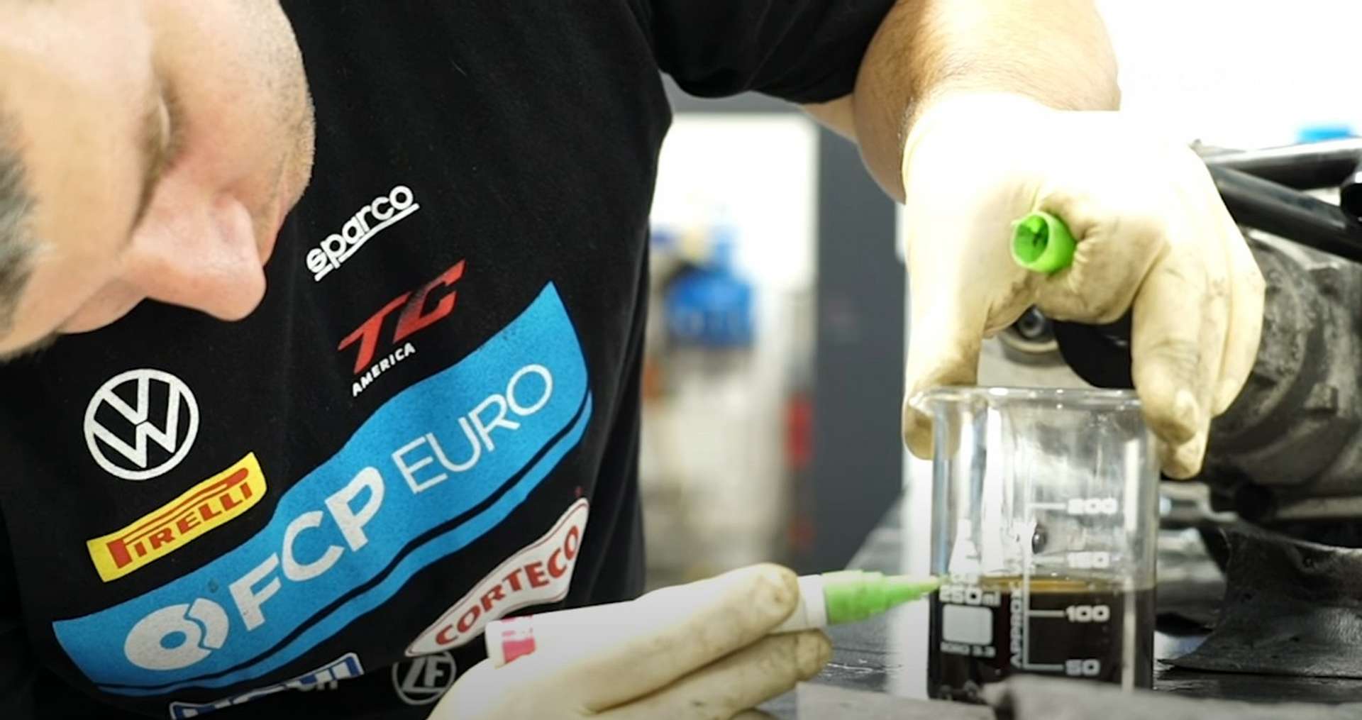 DIY Audi 3.0T Supercharger Oil Change measuring the supercharger oil