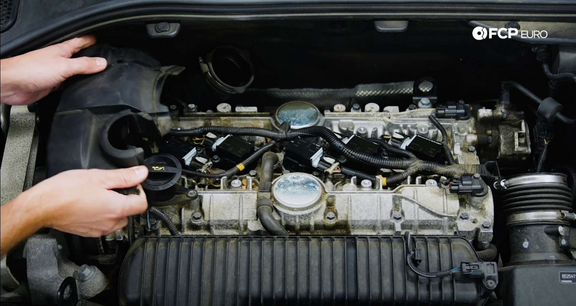 DIY Volvo Spark Plug and Ignition Coil Replacement refitting the timing cover